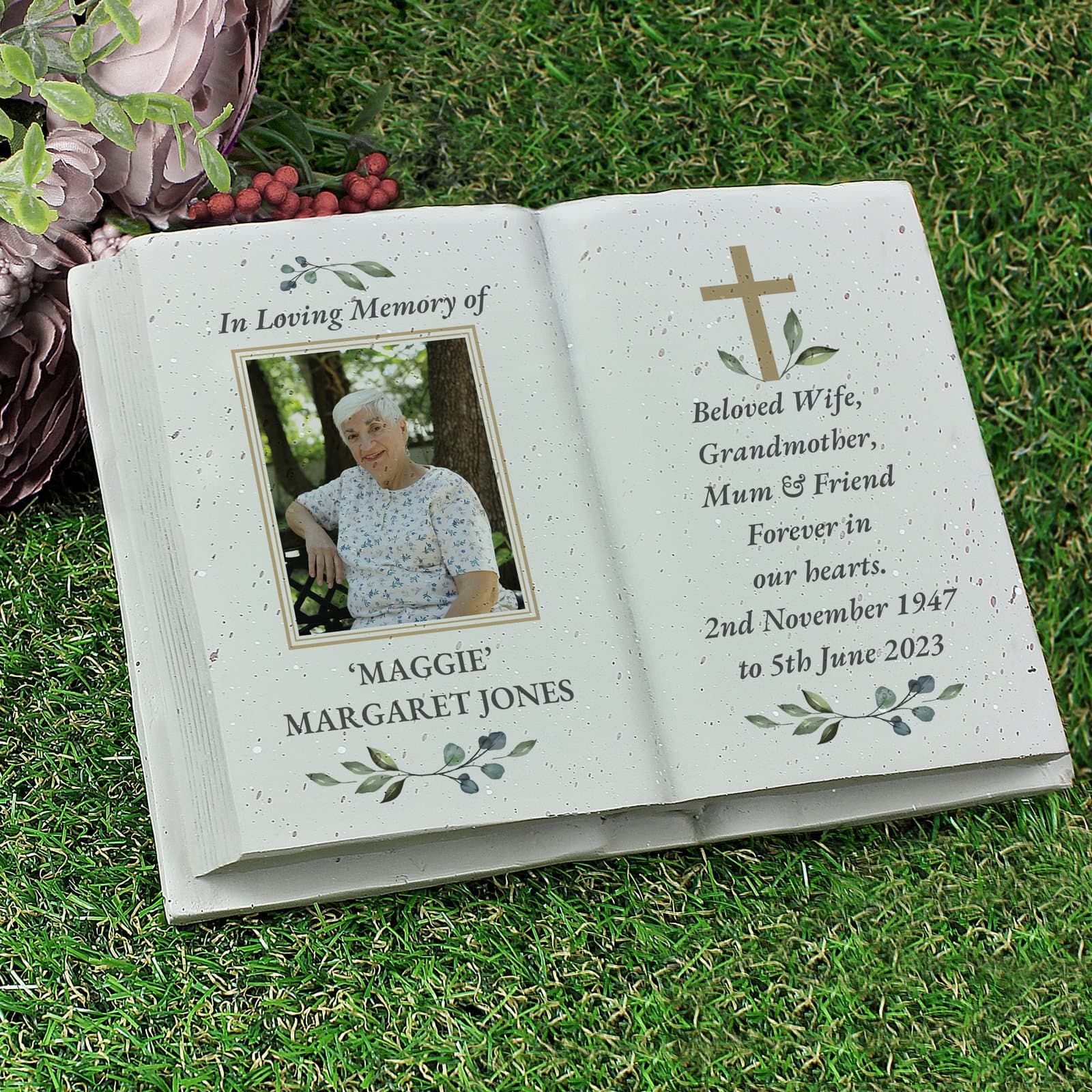 Memorial cross resin book with an uploaded photo and lines of text