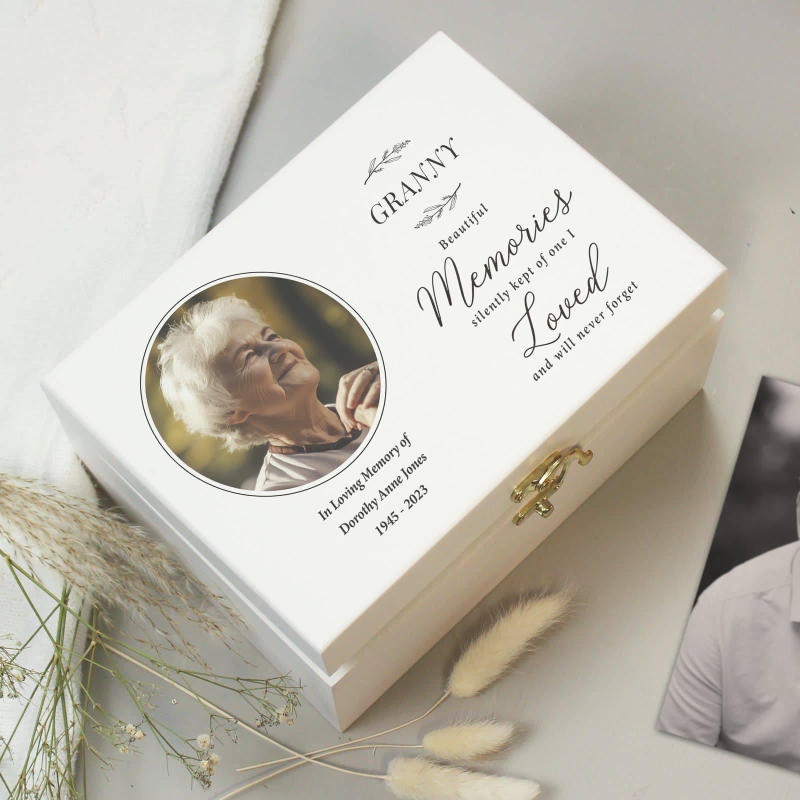White wooden memorial keepsake box with a photo and lines of text