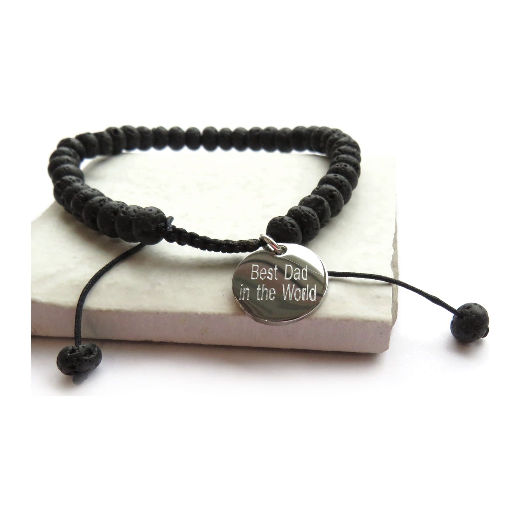 Personalised men's black lava bead bracelet with a stainless steel charm