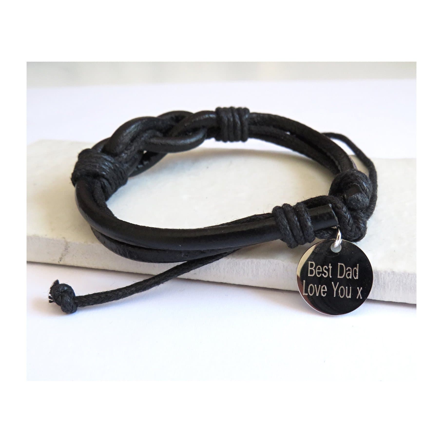 Personalised men's leather knot bracelet with a stainless steel disc