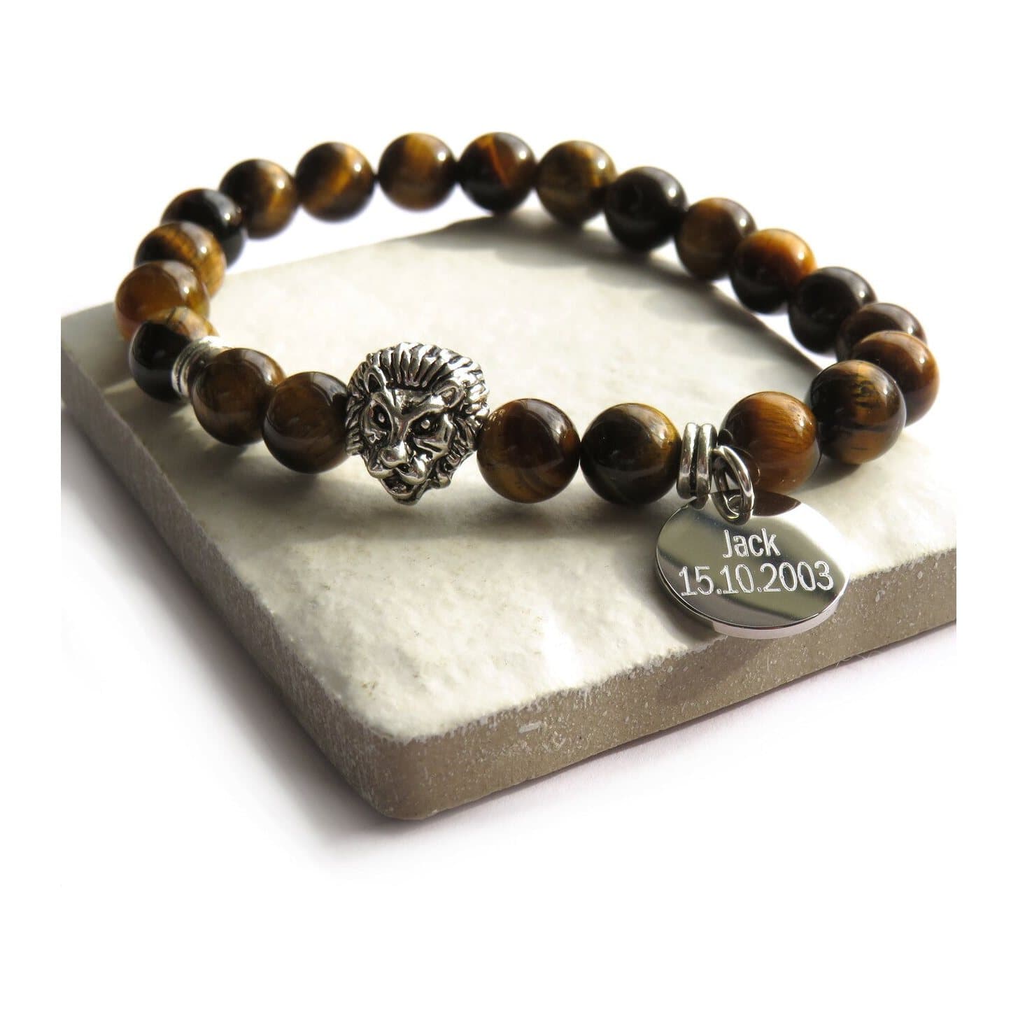 Tiger eye bead bracelet with a lion head charm on elasticated thread