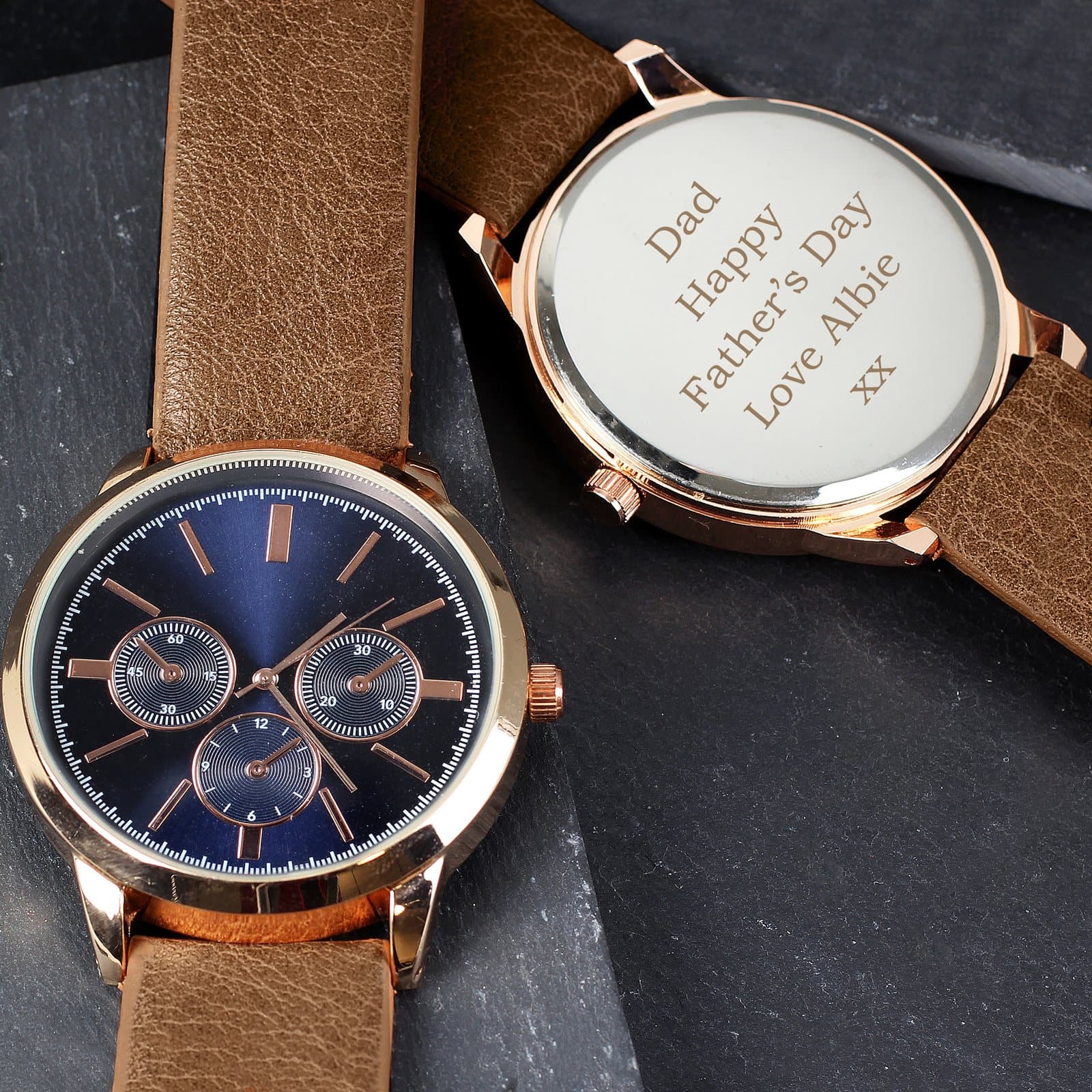 Men's rose gold tone watch with a brown strap and a 4 cm clock face