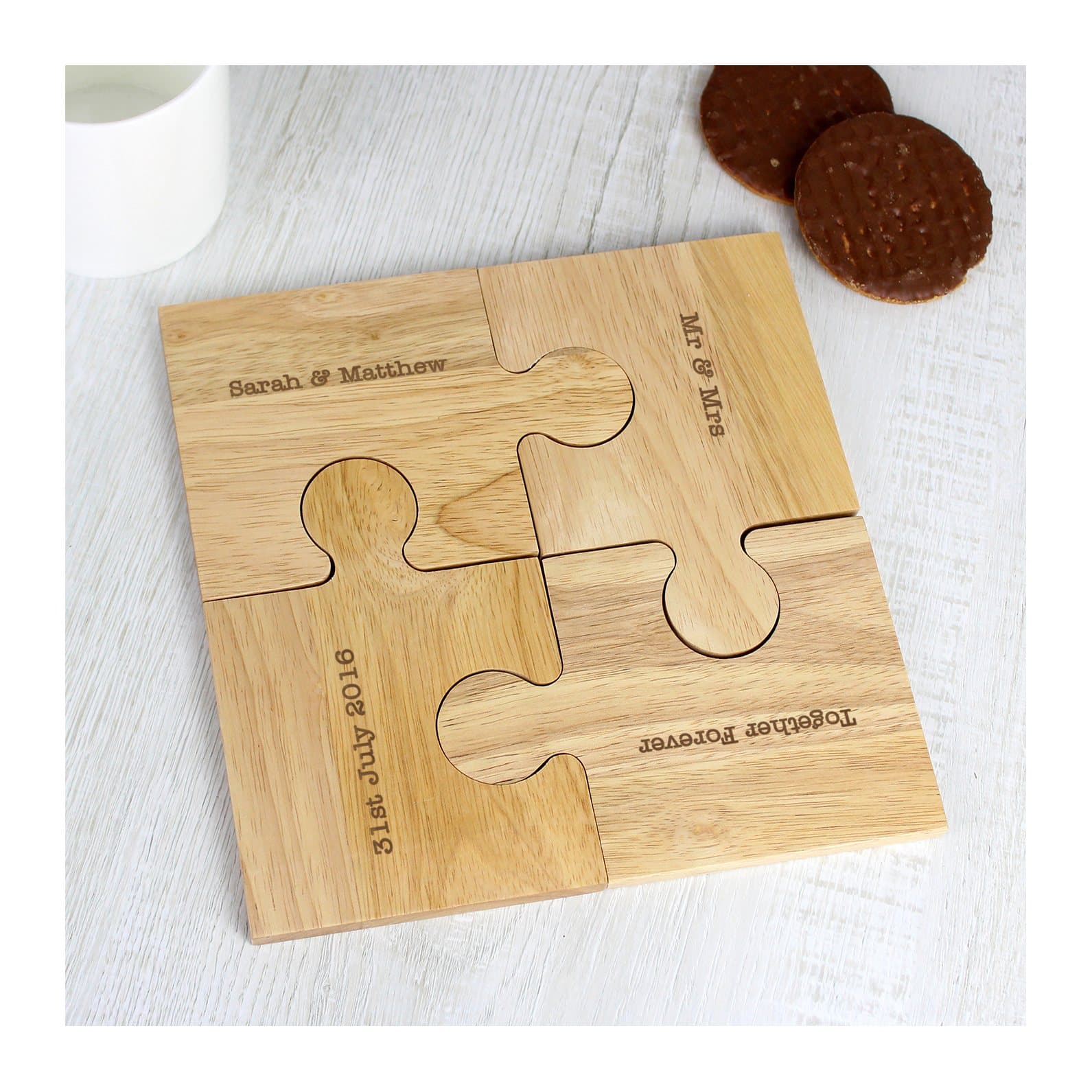 Four wooden jigsaw coasters with personalised lines of text