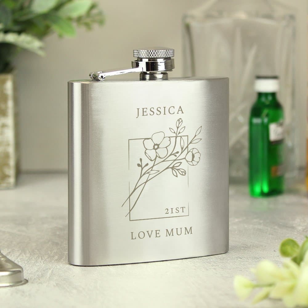 Stainless steel hip flask with a monochrome floral design and engraved text