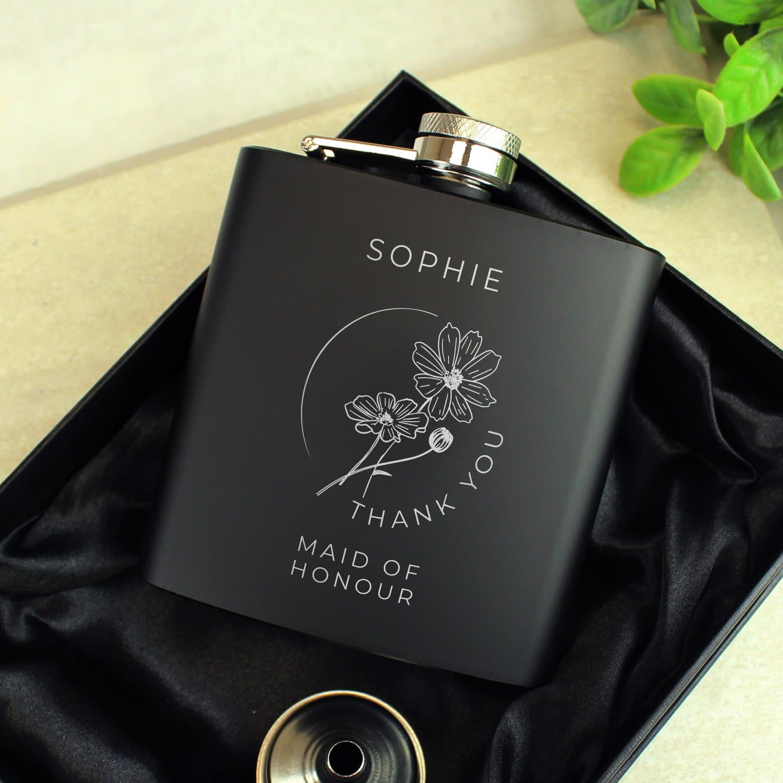 Black stainless steel hip flask with a monochrome floral design for the bridal party