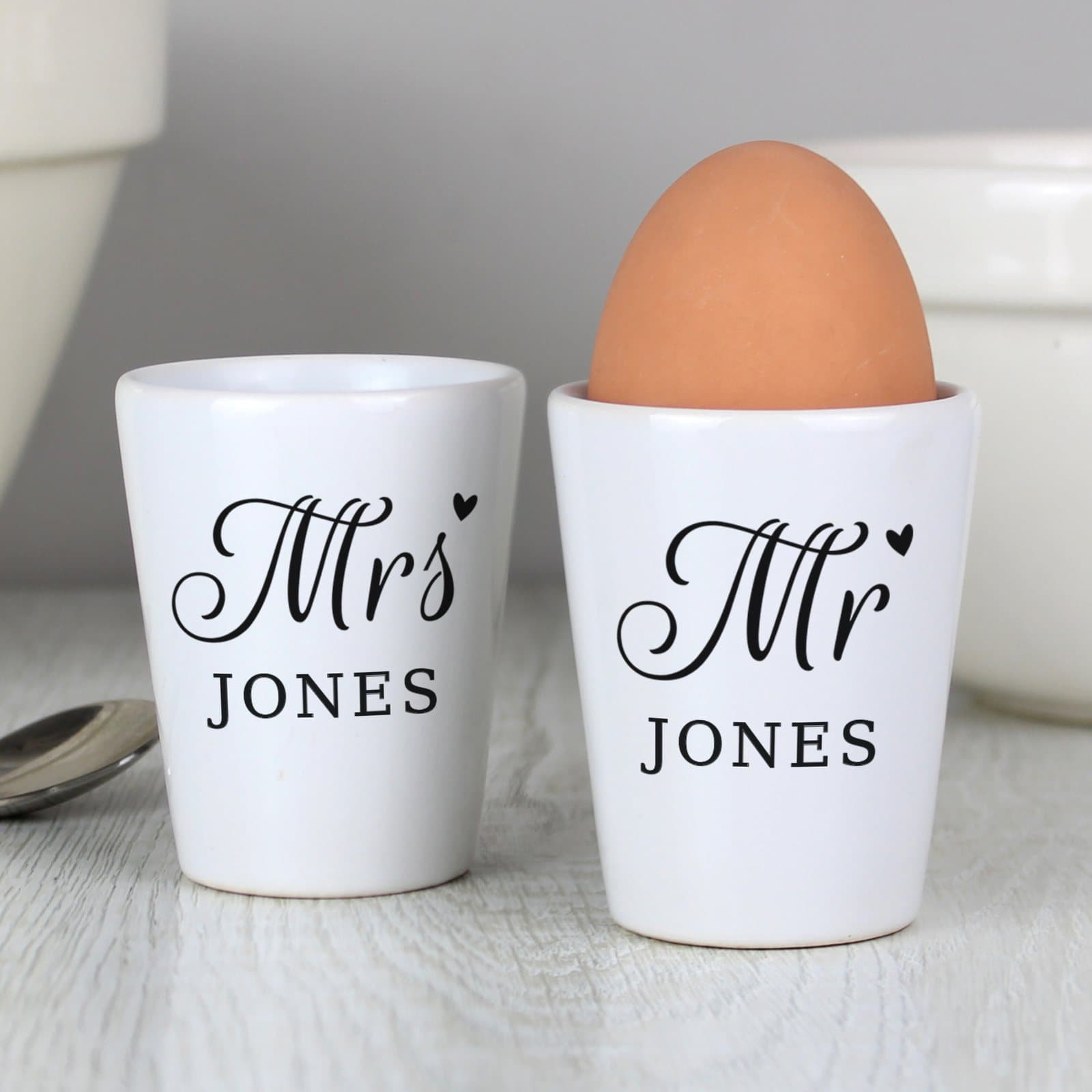 Ceramic Mr and Mrs egg cups personalised with a surname