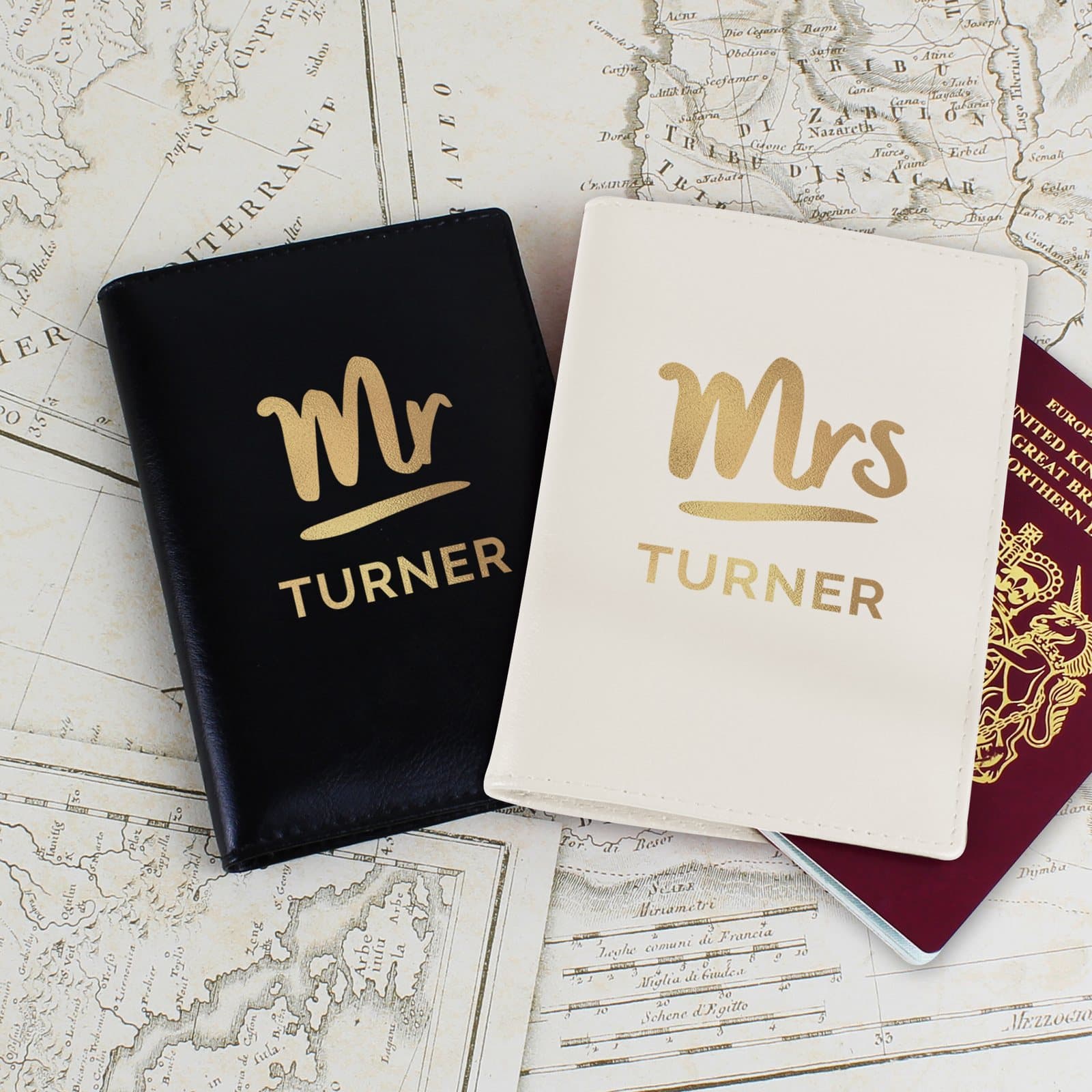 Cream and black leather passport holders marked Mr and Mrs
