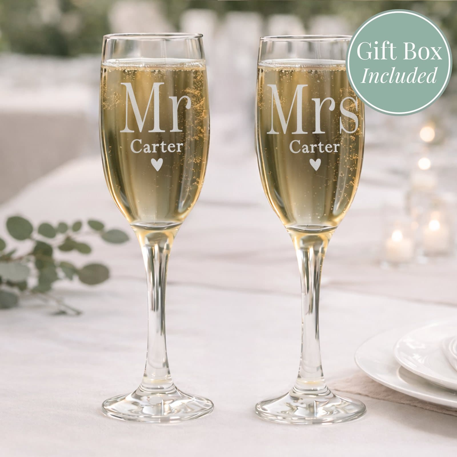 Pair of glass champagne flutes personalised with a surname and Mr & Mrs
