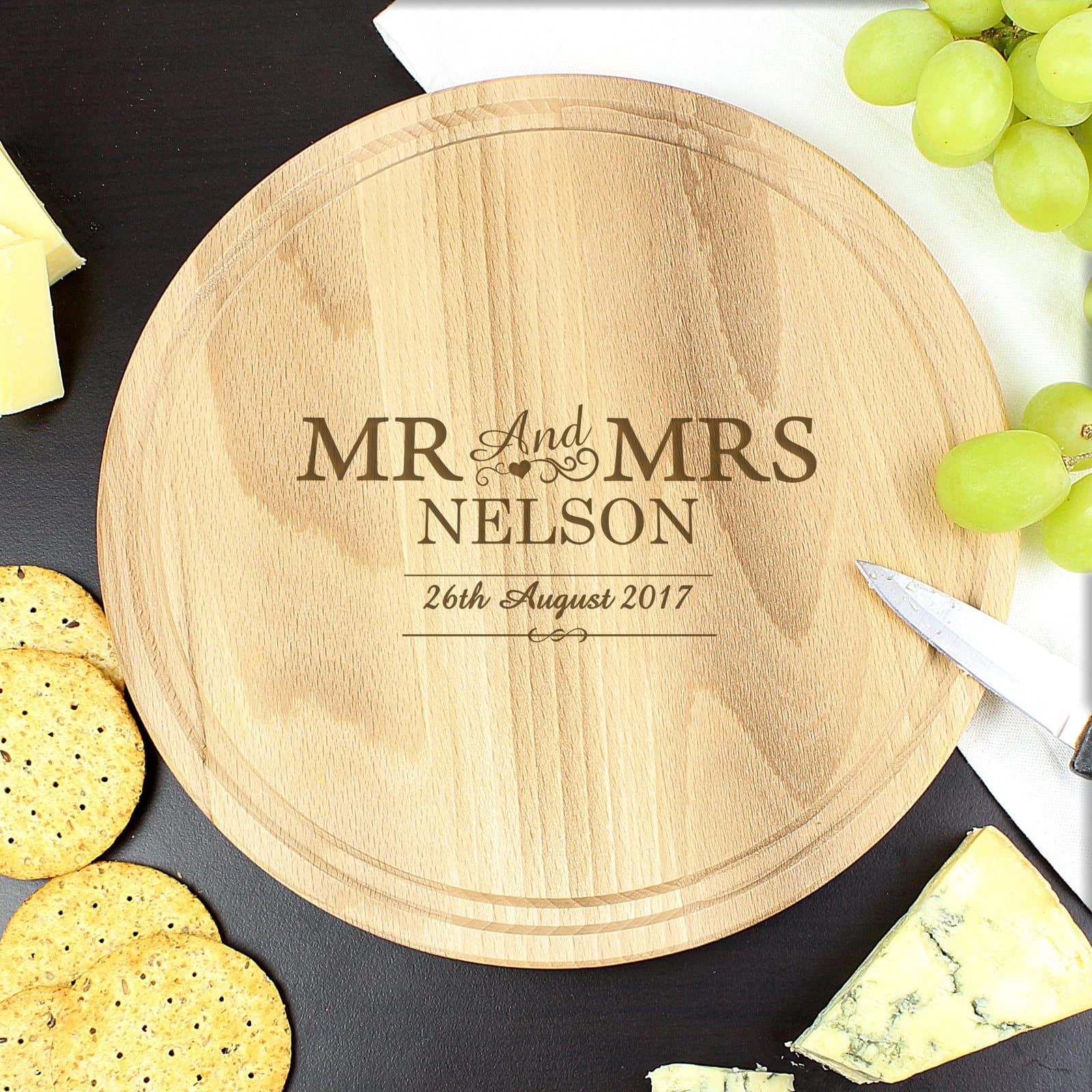 Round chopping board personalised with Mr & Mrs, a surname and a date