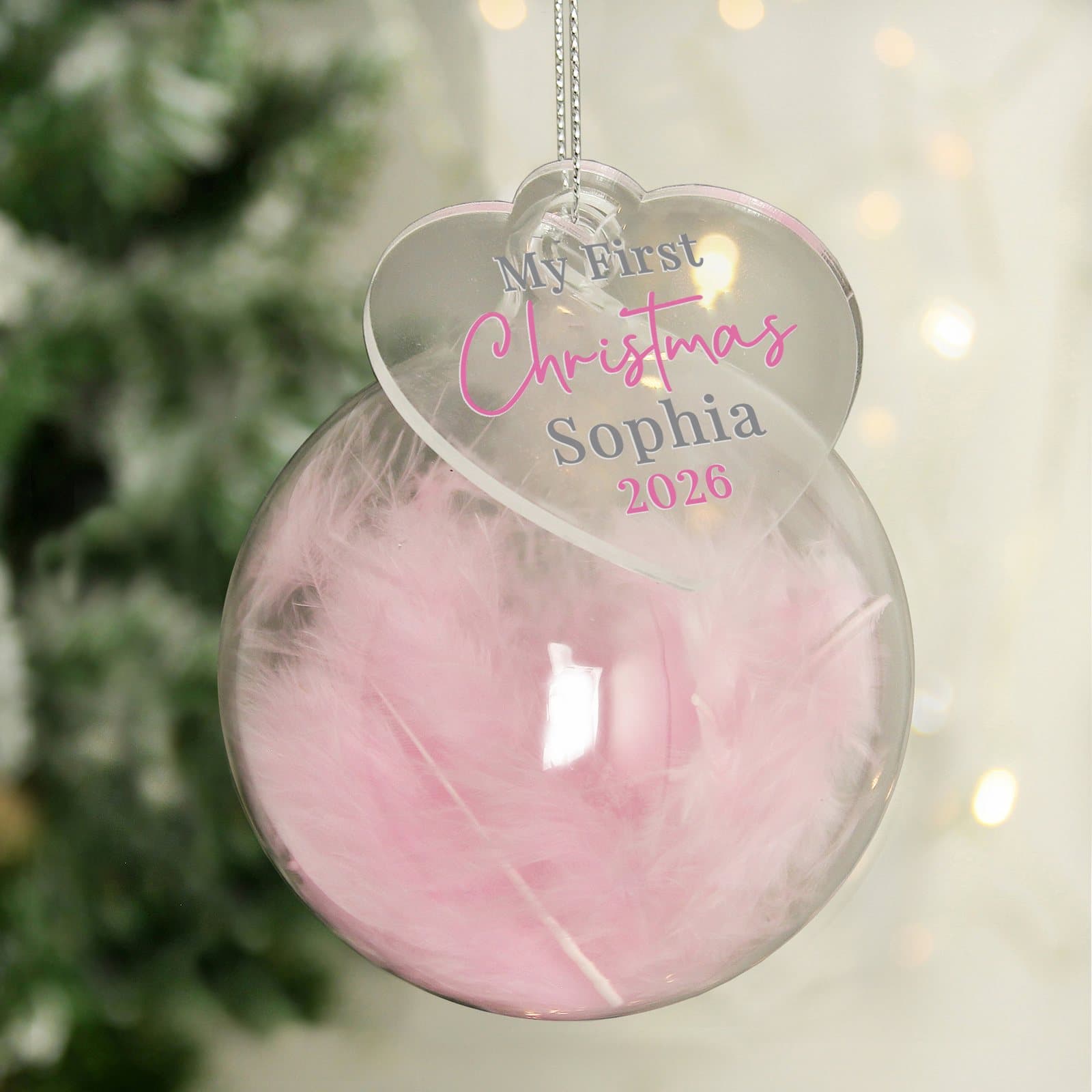 Feather glass bauble with a heart tag