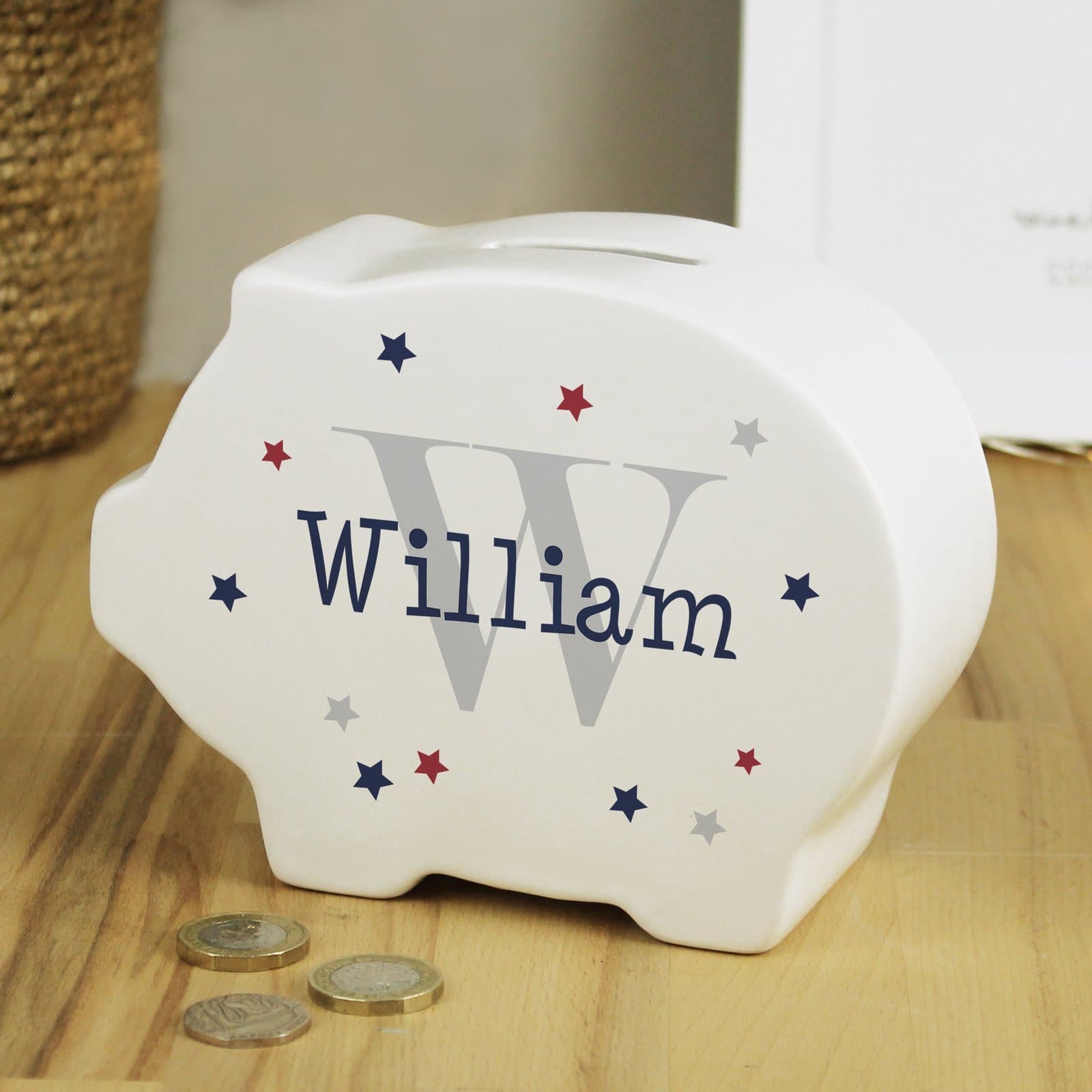 Ceramic personalised piggy bank with a name and initial