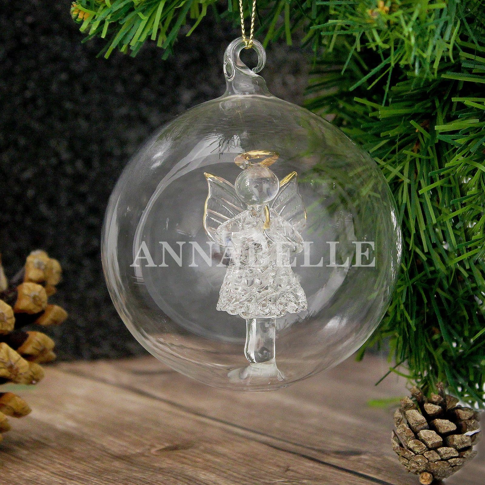 Glass bauble with a glass angel inside