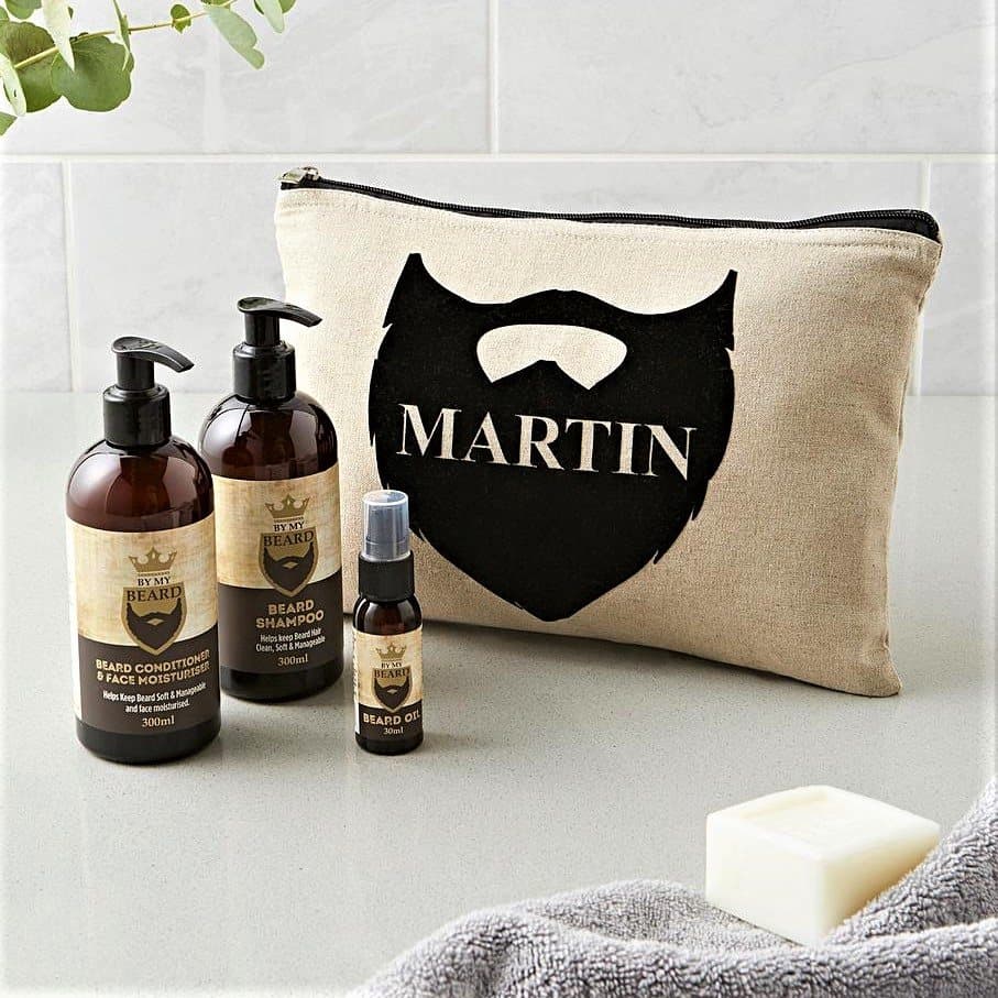 Padded canvas beard kit bag with bottles of beard care products