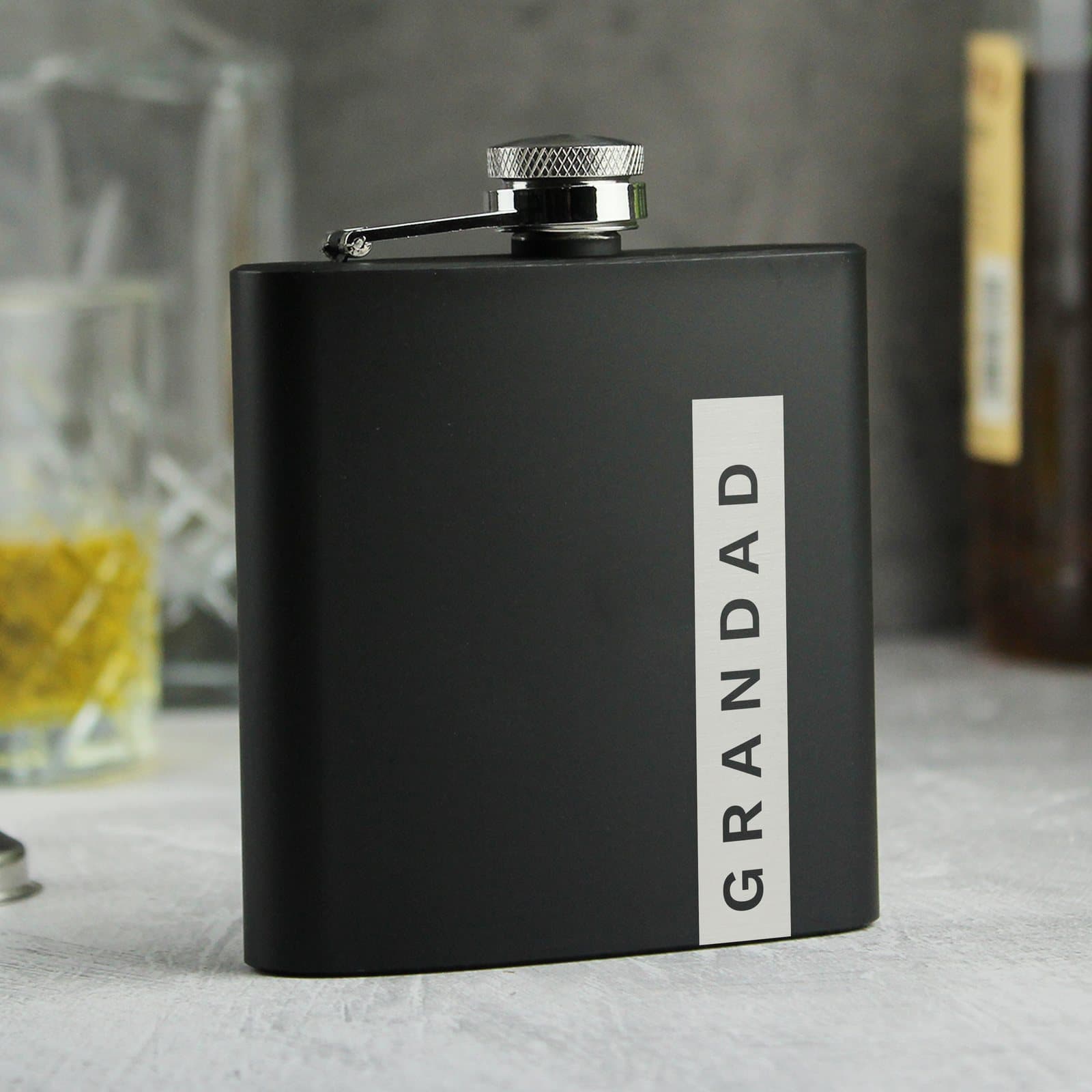 Black stainless steel hip flask personalised with a name