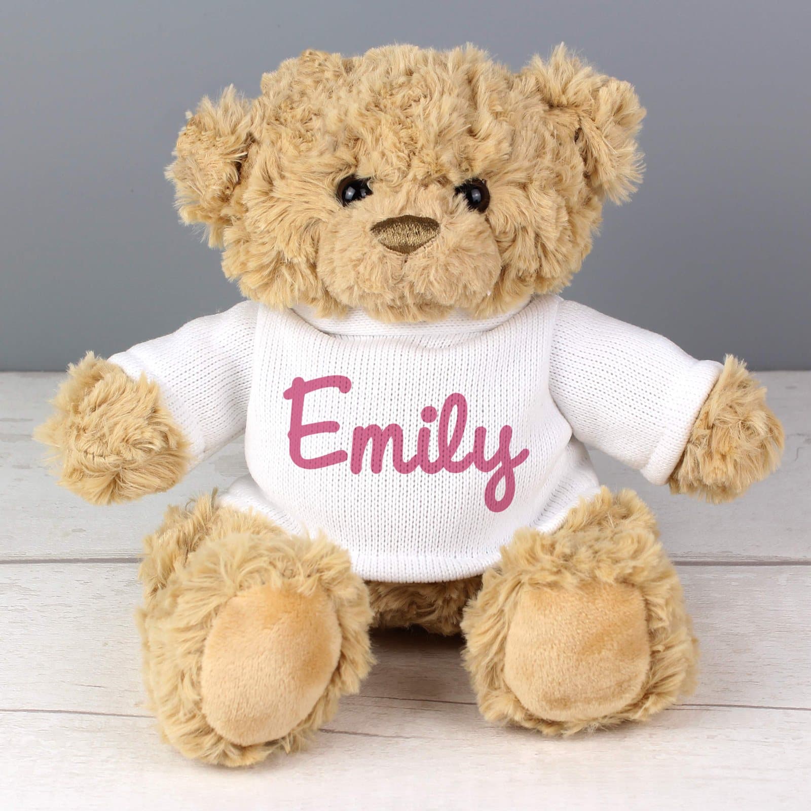 Plush teddy bear wearing a jumper