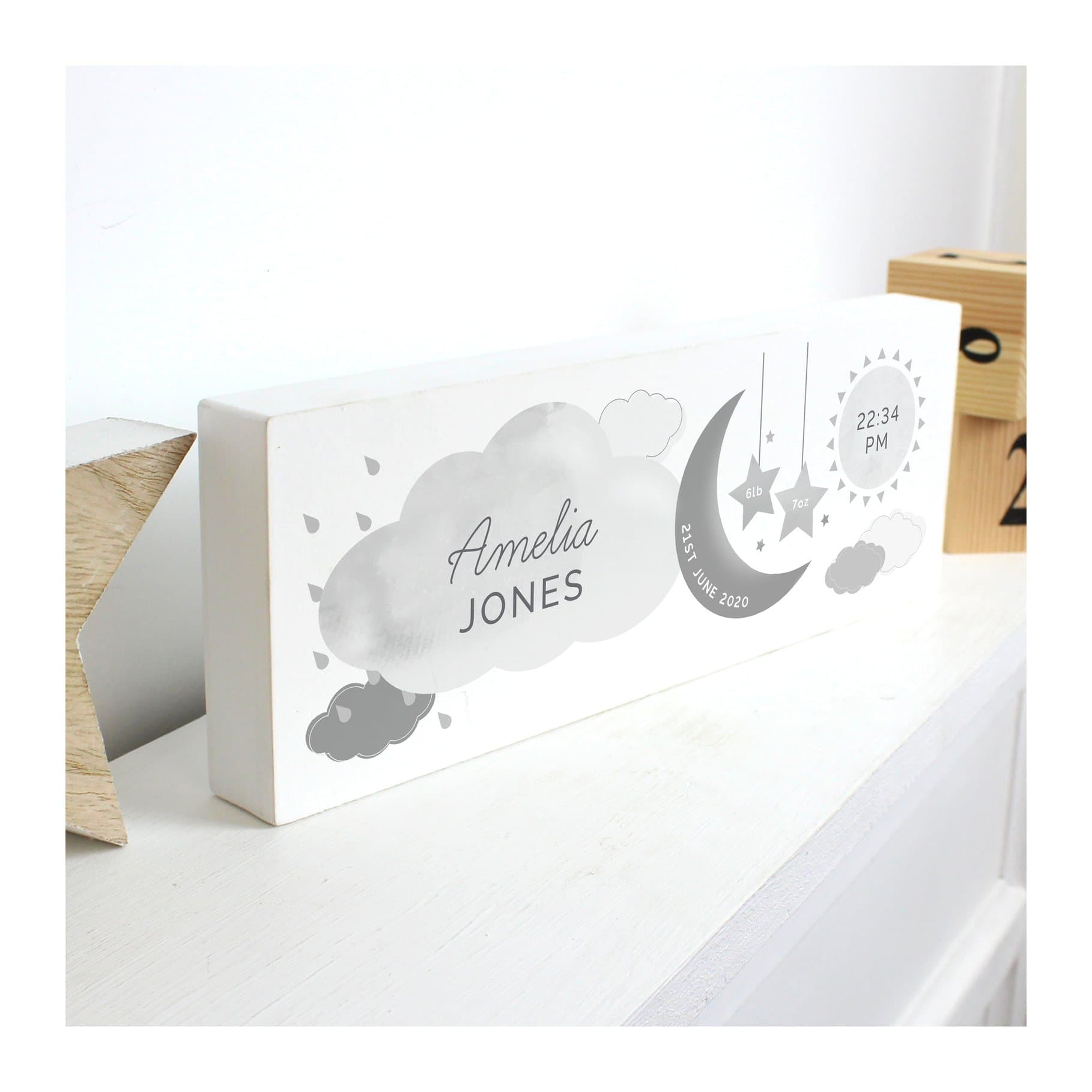 Wooden new baby block sign with moon, stars, cloud and sun