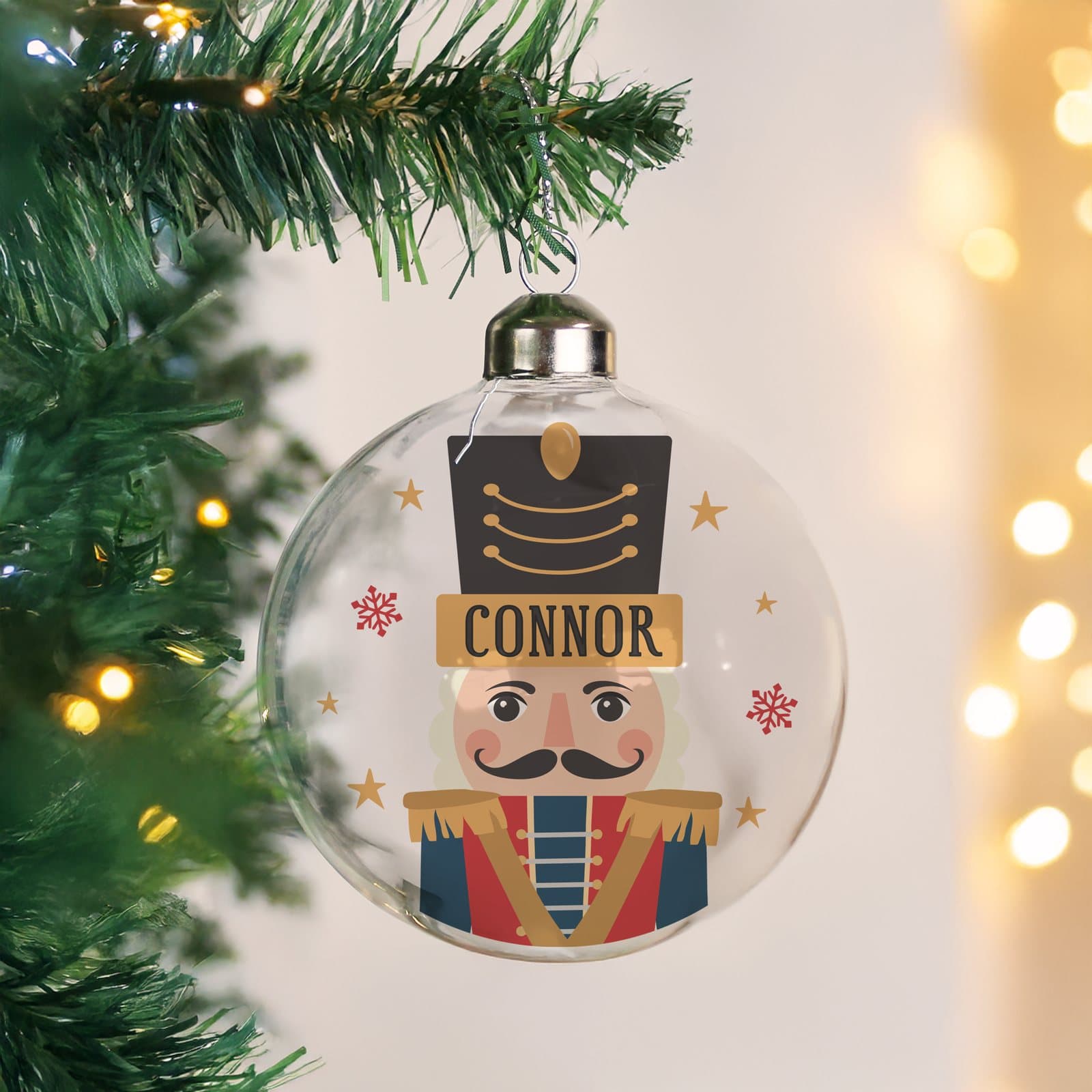 Glass nutcracker Christmas bauble with a ribbon for hanging
