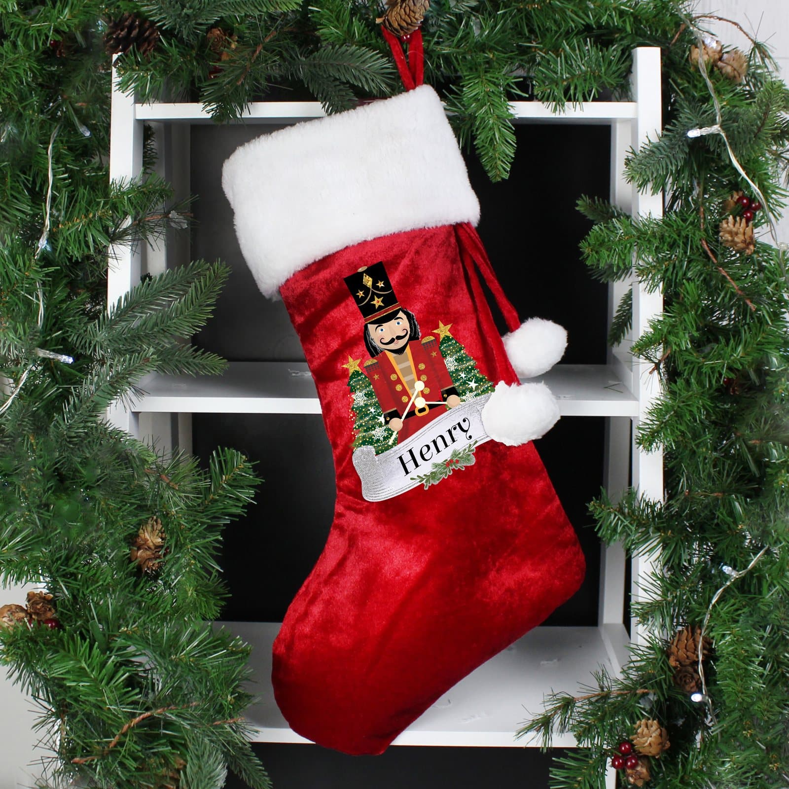 Red velvet nutcracker Christmas stocking with a white plush cuff and hanging hoop