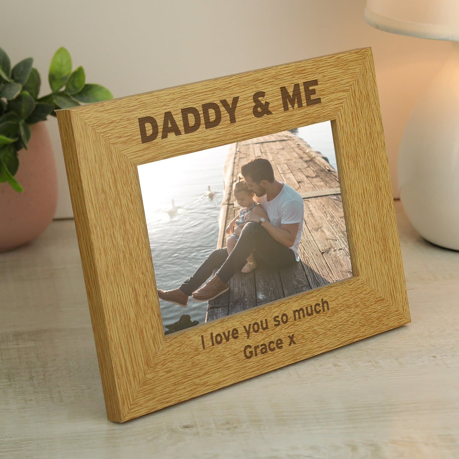 Oak finish Daddy & Me landscape photo frame with a message below the photo