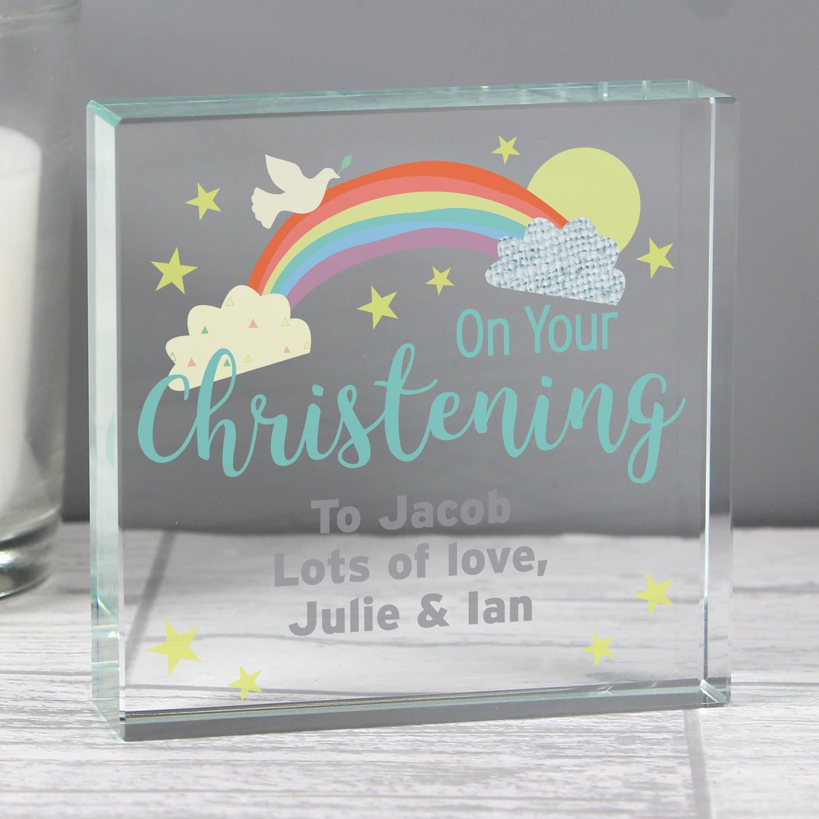 Crystal token with On Your Christening wording beside a black gift box