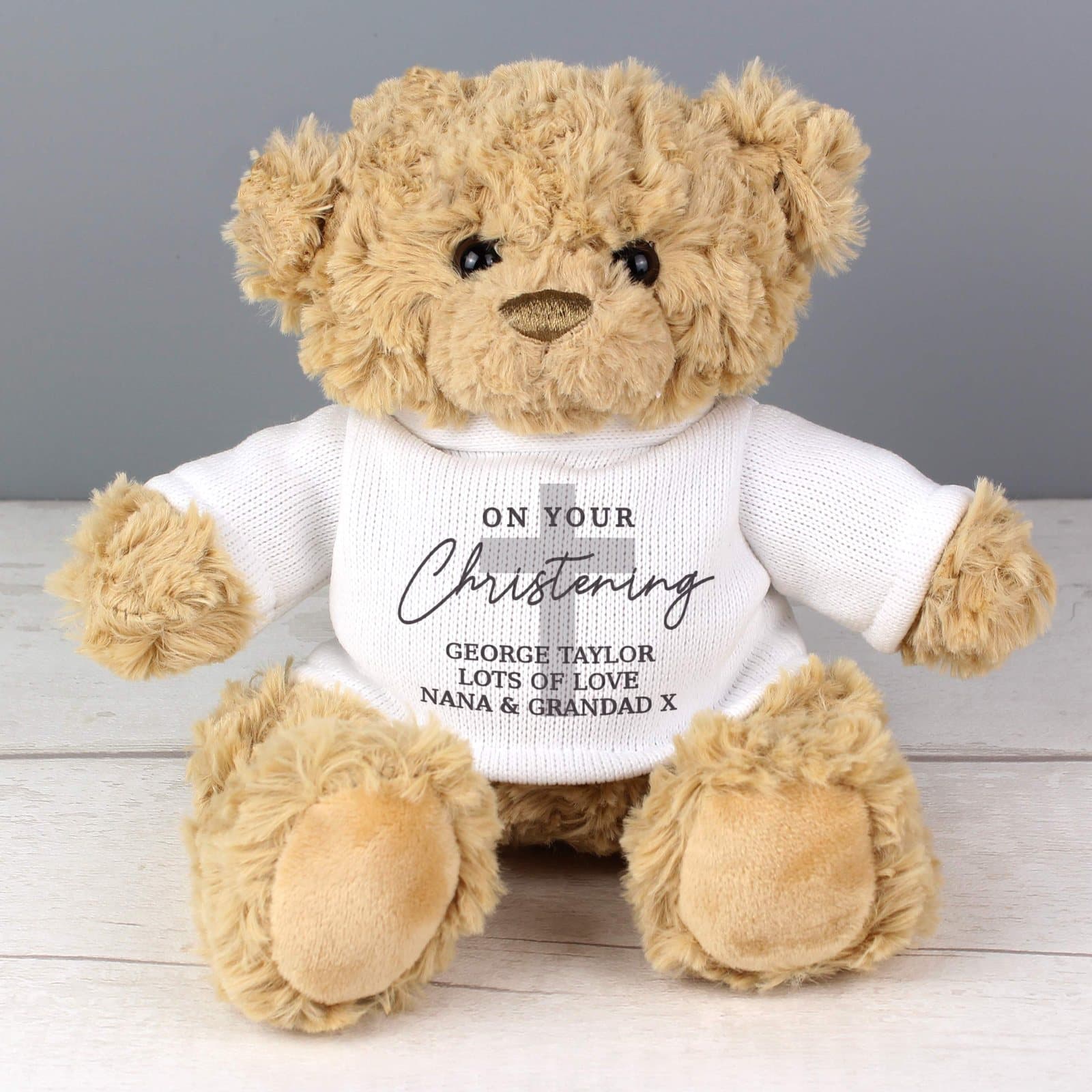 Plush teddy bear in a t-shirt with On Your Christening text