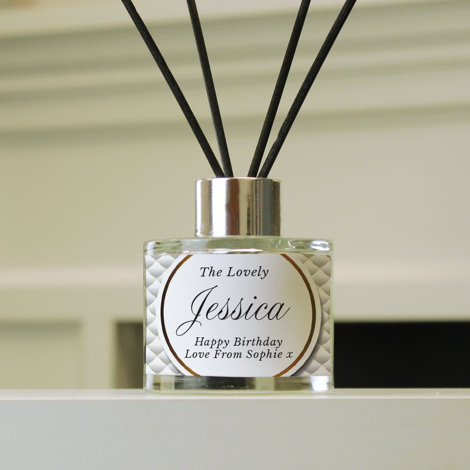 Personalised glass reed diffuser with four lines of text