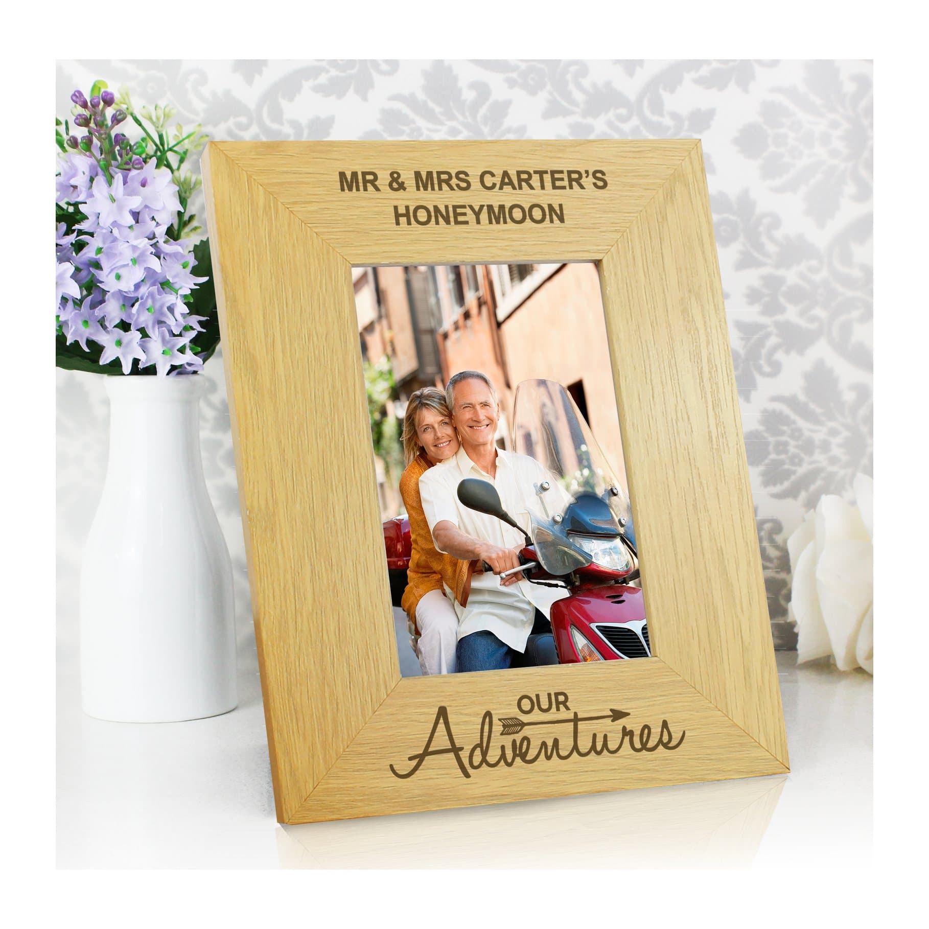 Oak veneer Our Adventures photo frame with two lines of text above the photo