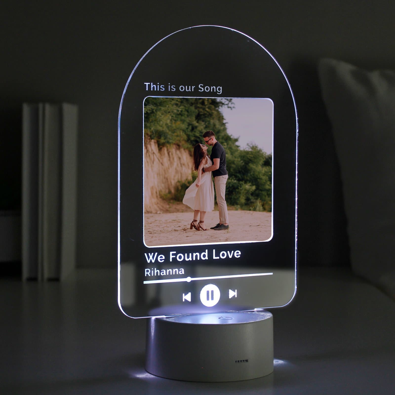 Acrylic LED light sign with a photo, a line above and song details below