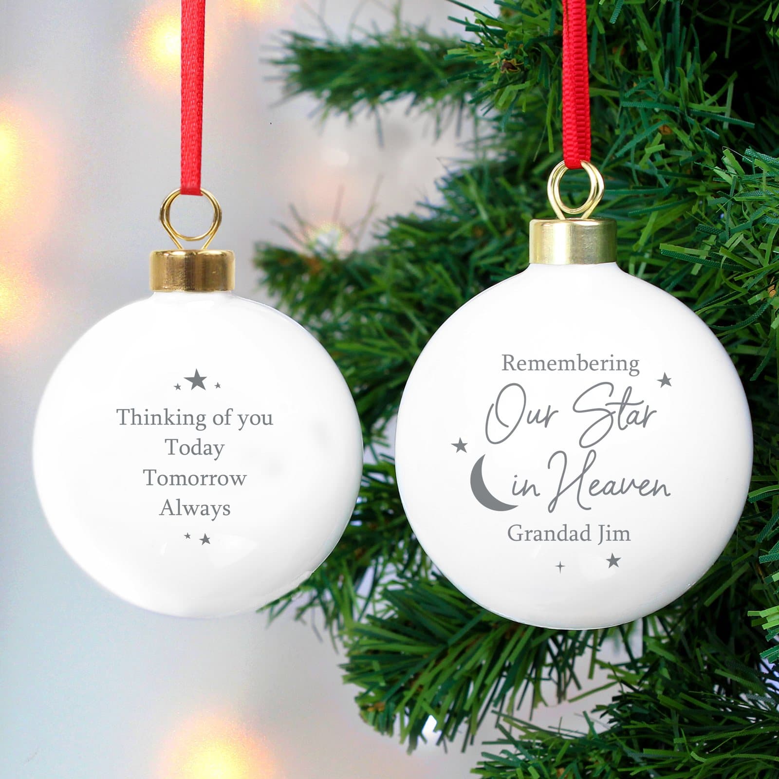 Ceramic memorial bauble with a gilt clasp and ribbon for hanging