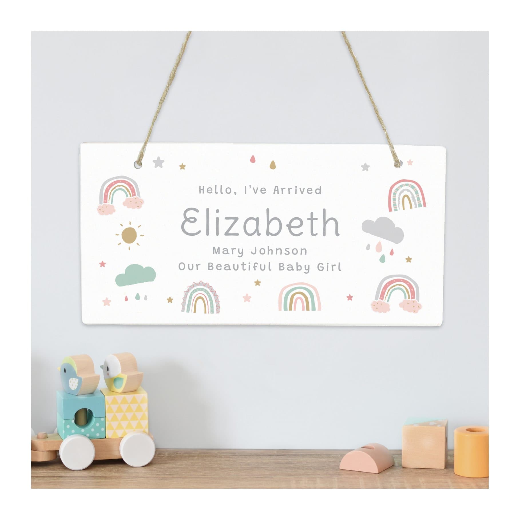 Pastel rainbow wooden sign with ribbon, a name and message lines
