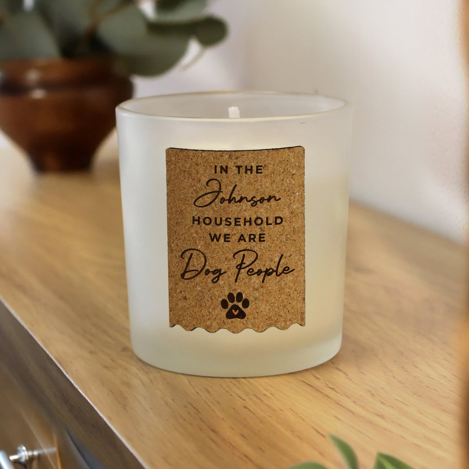 Vanilla glass candle jar with a personalised paw print cork label