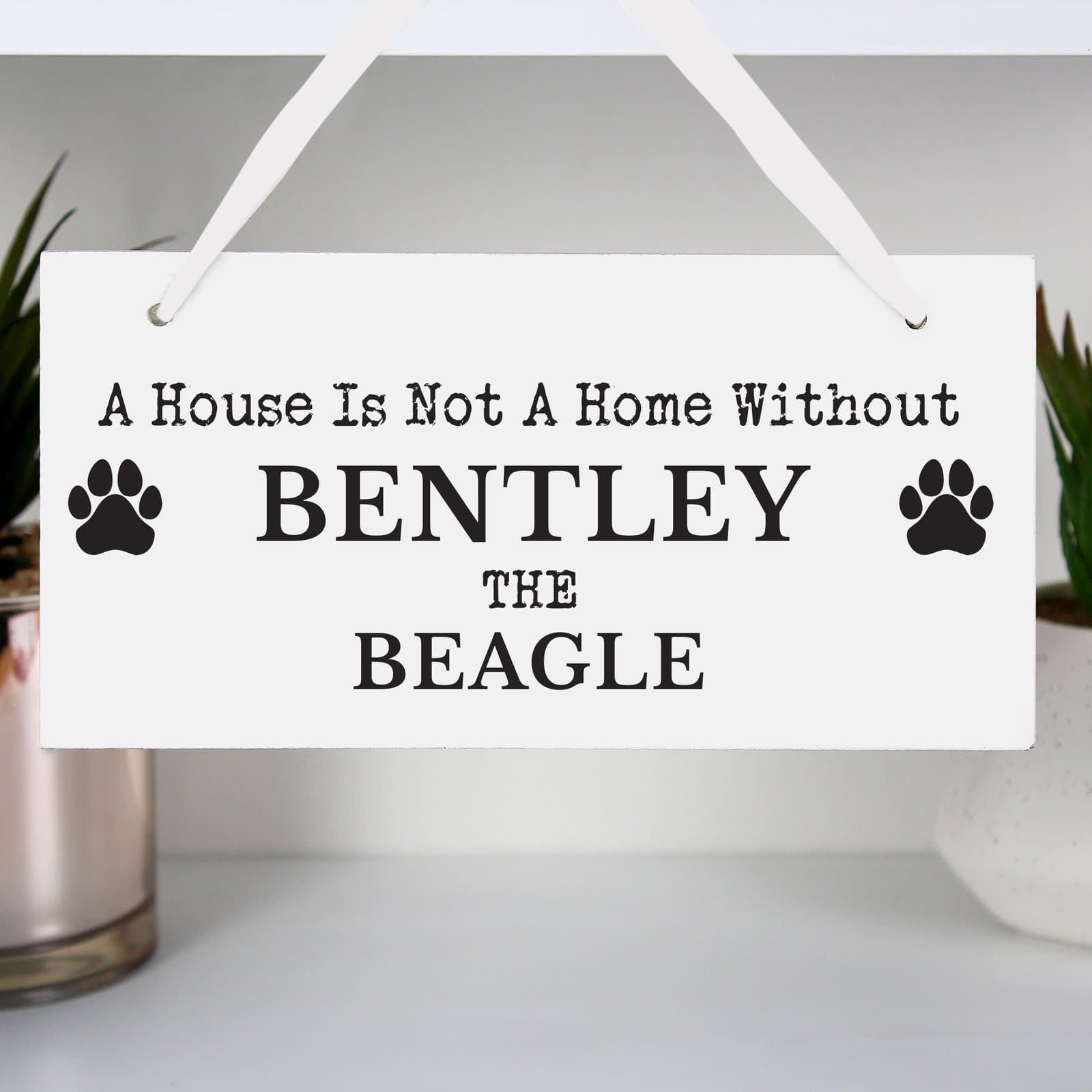 Wooden paw print dog breed sign with string and a dog name and breed