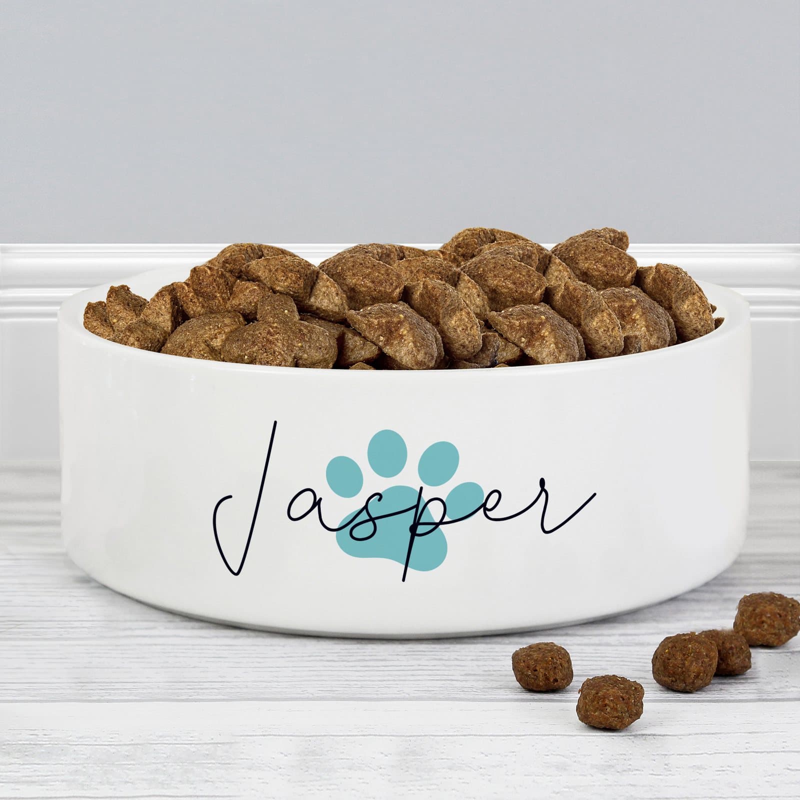 Personalised ceramic paw print pet bowl with a pet's name