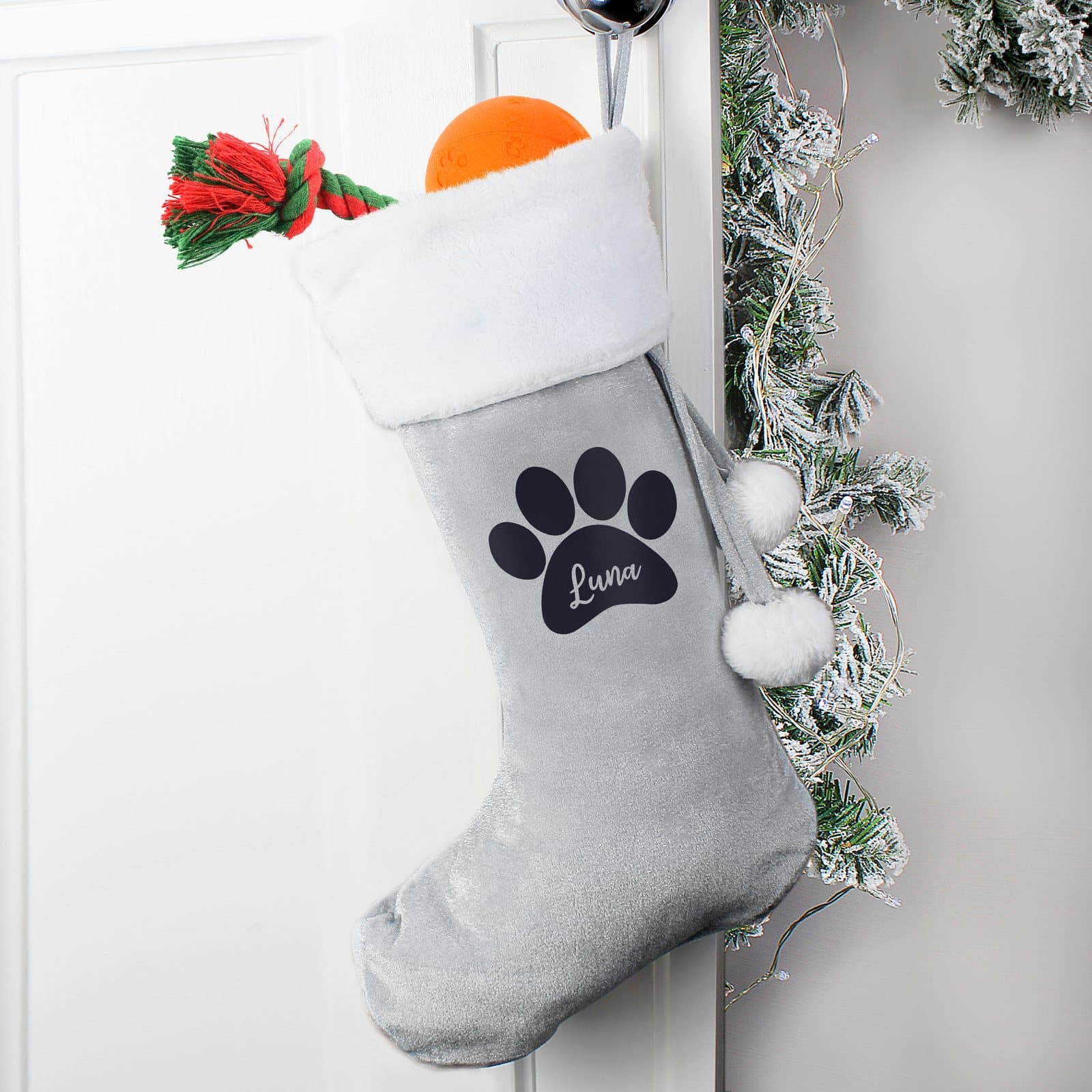 Velvet paw print Christmas stocking for pets with a plush white cuff