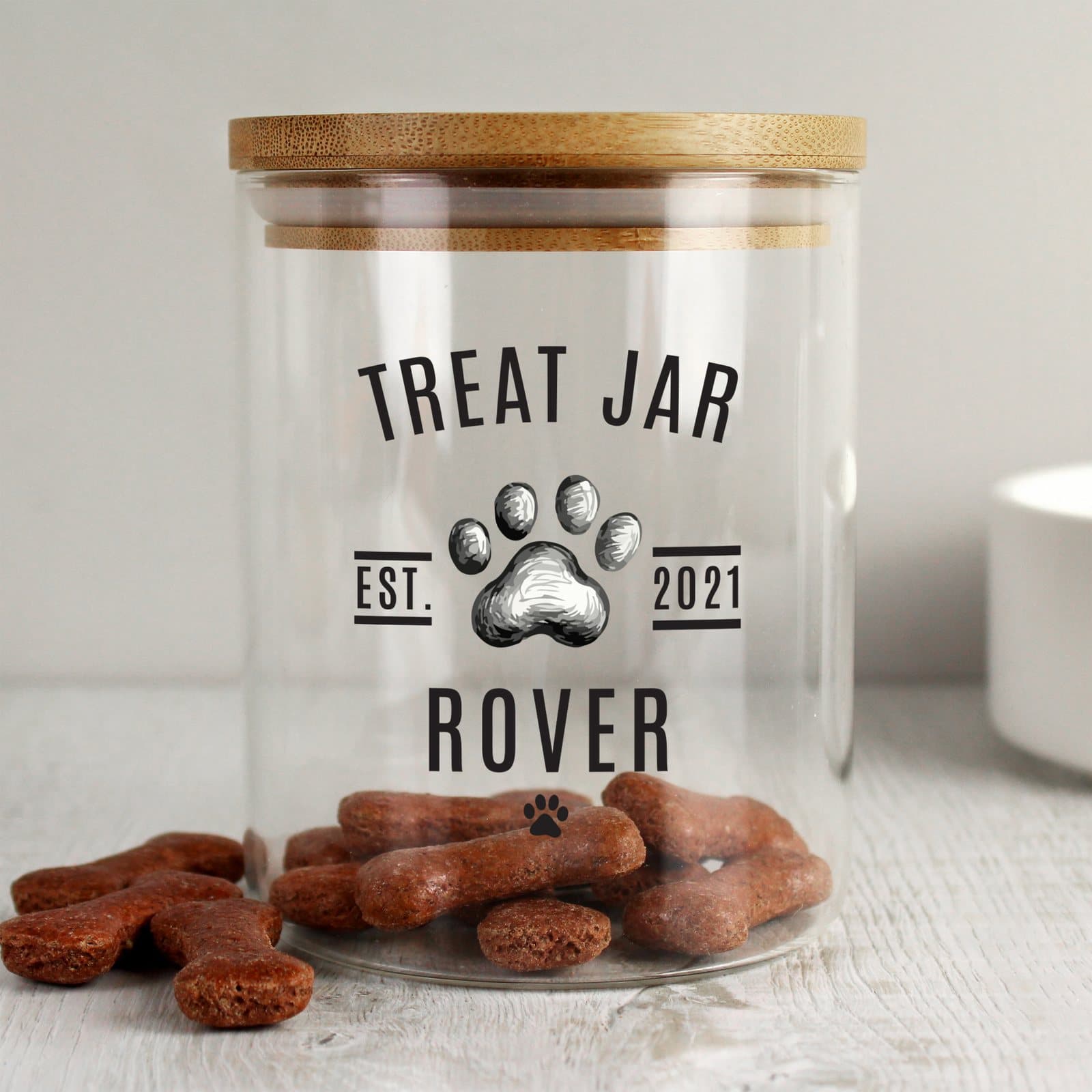 Glass pet treat jar with a bamboo lid, personalised with a name and year