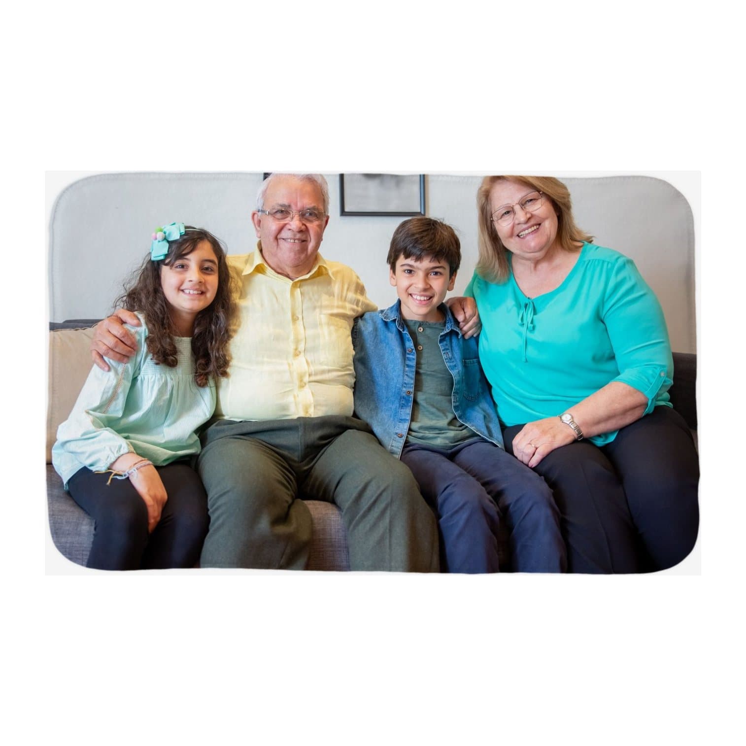 Fleece blanket printed with grandparents and grandchildren on a sofa