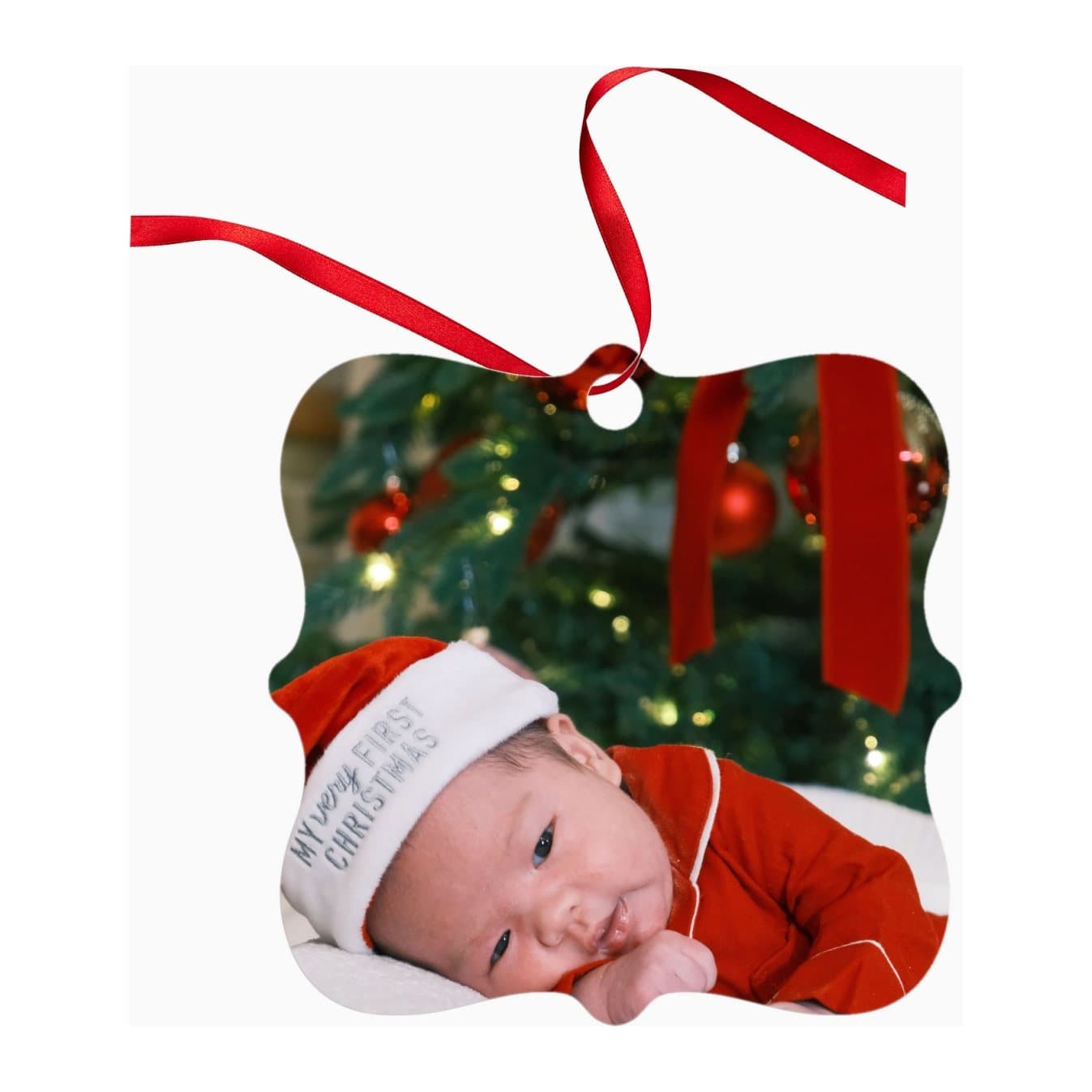 Shaped aluminium Christmas decoration printed with a baby photo, on a red ribbon