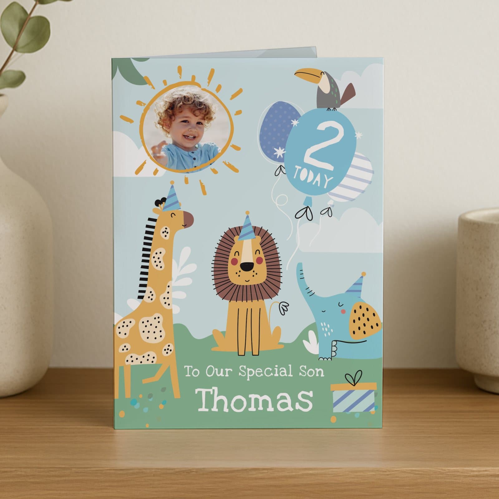 Birthday card with animal illustrations, a photo, an age and a message