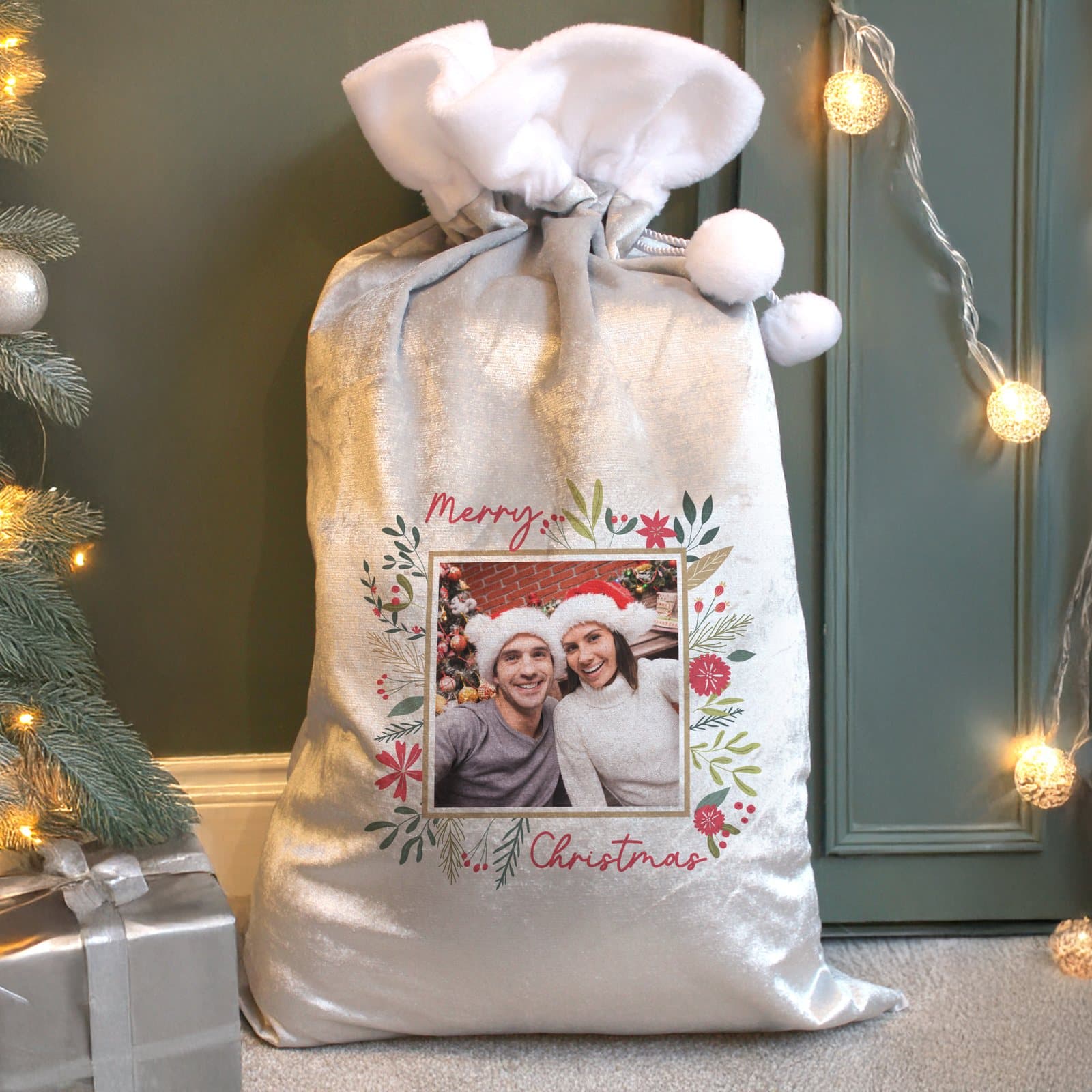 Fleece Christmas sack with a festive botanic design and Merry Christmas text