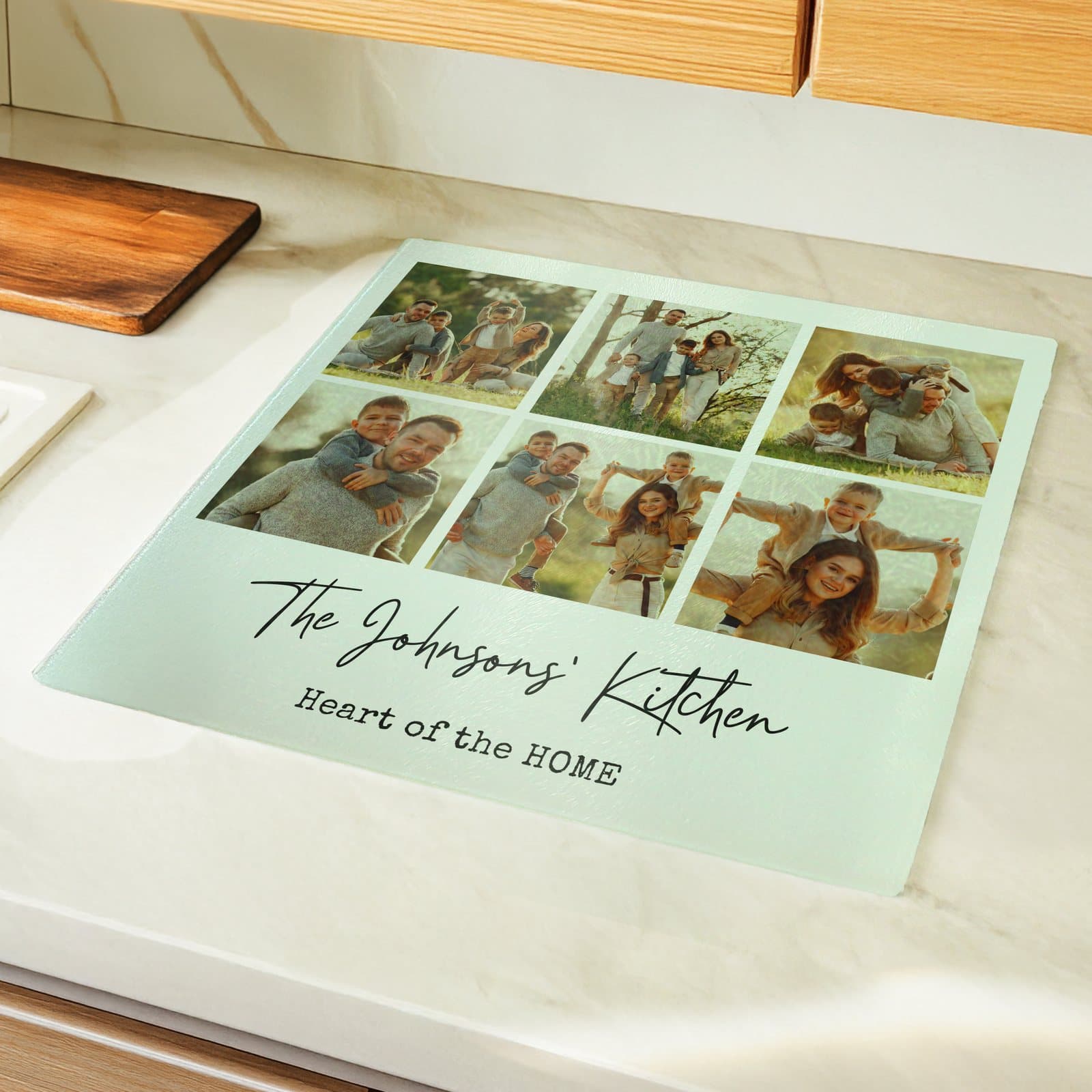 Glass chopping board with six photos and a two-line message