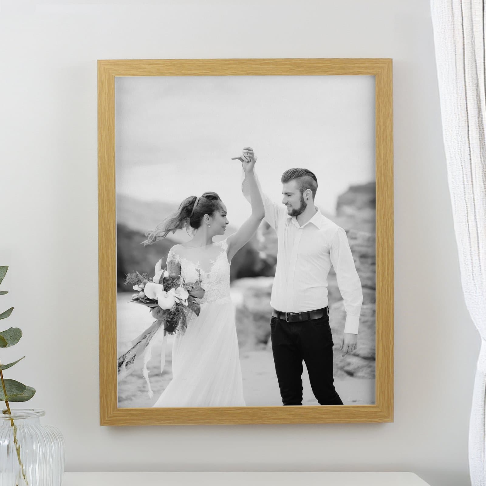 Personalised photo upload poster in a large oak portrait frame