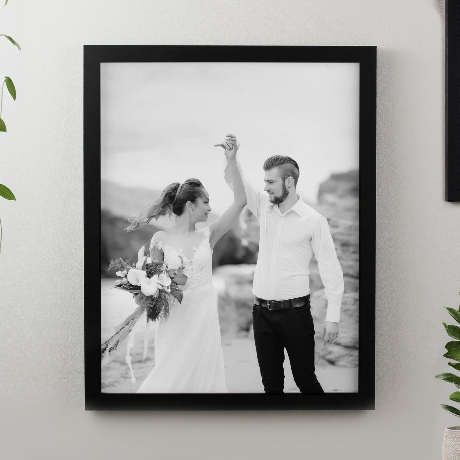 Personalised photo upload poster frame in black or white holding a photo