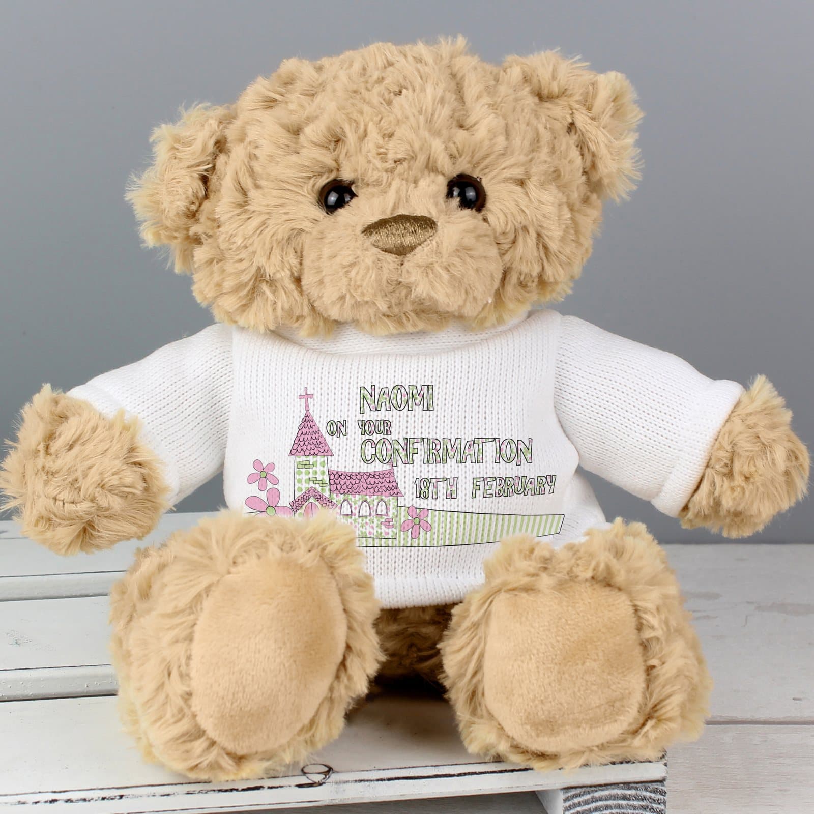 Teddy bear in a T-shirt with a pink church design