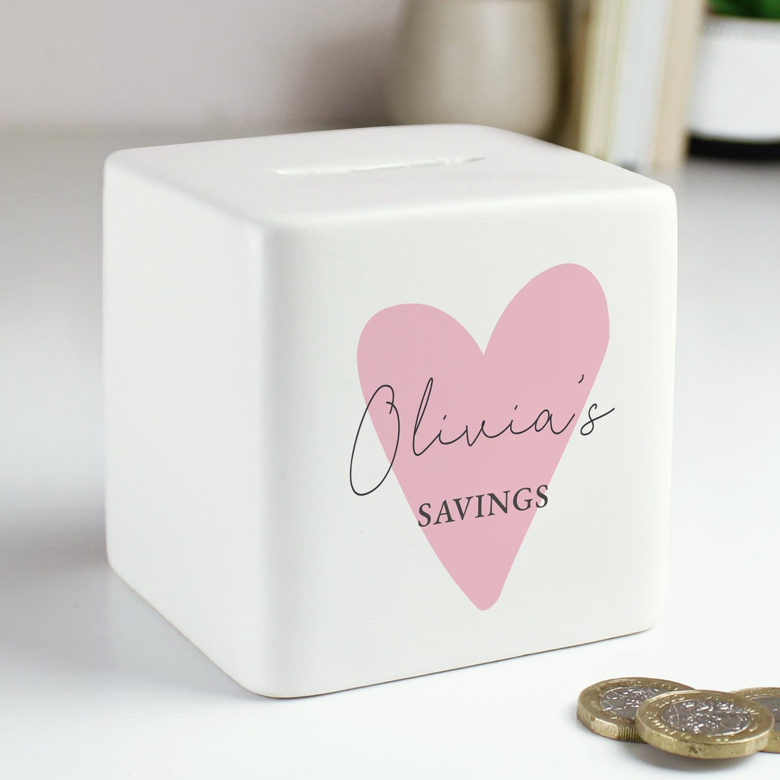 Pink square ceramic money box with a heart and a personalised name