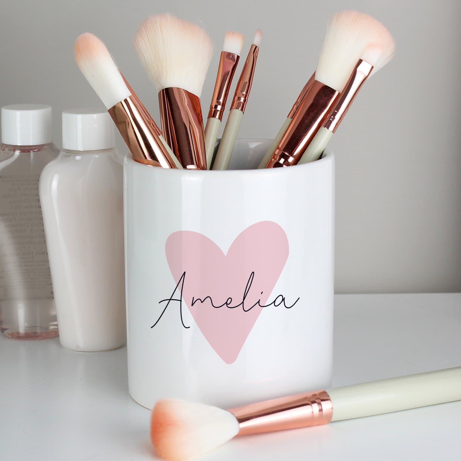 Pink heart ceramic storage pot with a personalised name in script