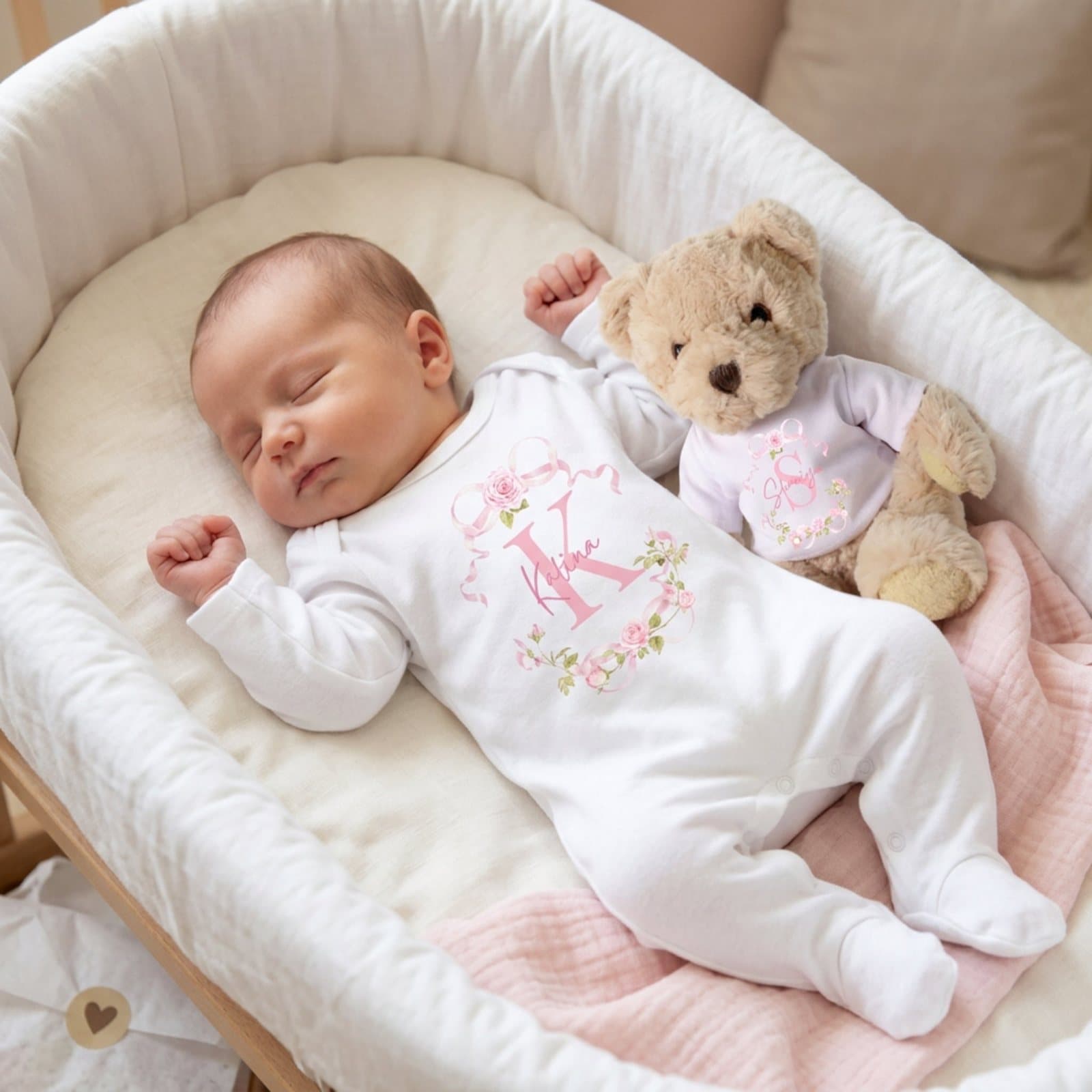 Pink roses baby gift box with a teddy bear and a personalised baby vest.
