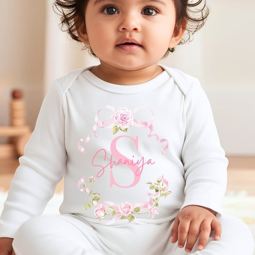 Pink roses design with a name on a baby grow, vest or bib