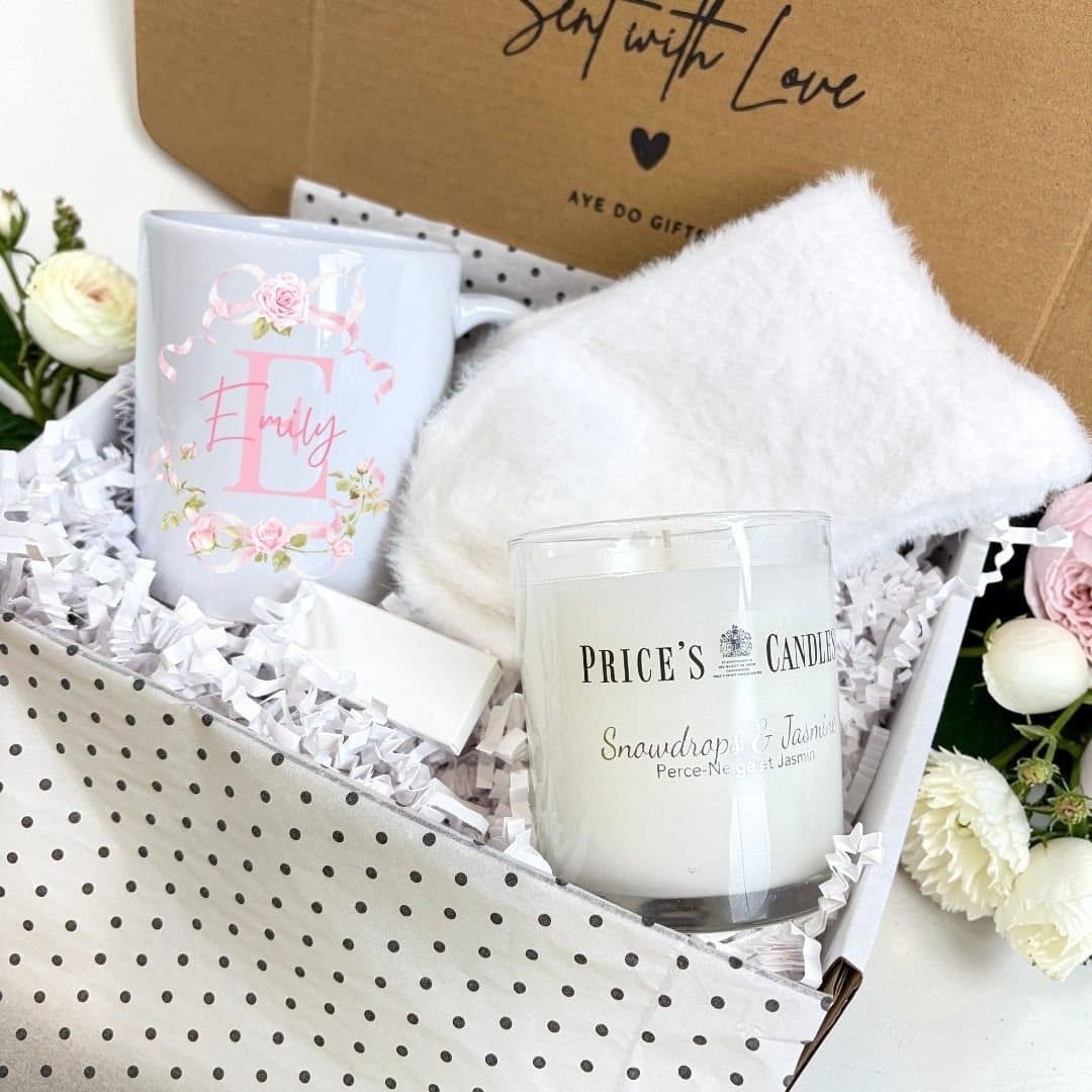 Pink Roses mug, fluffy socks, scented candle and matches in a gift hamper