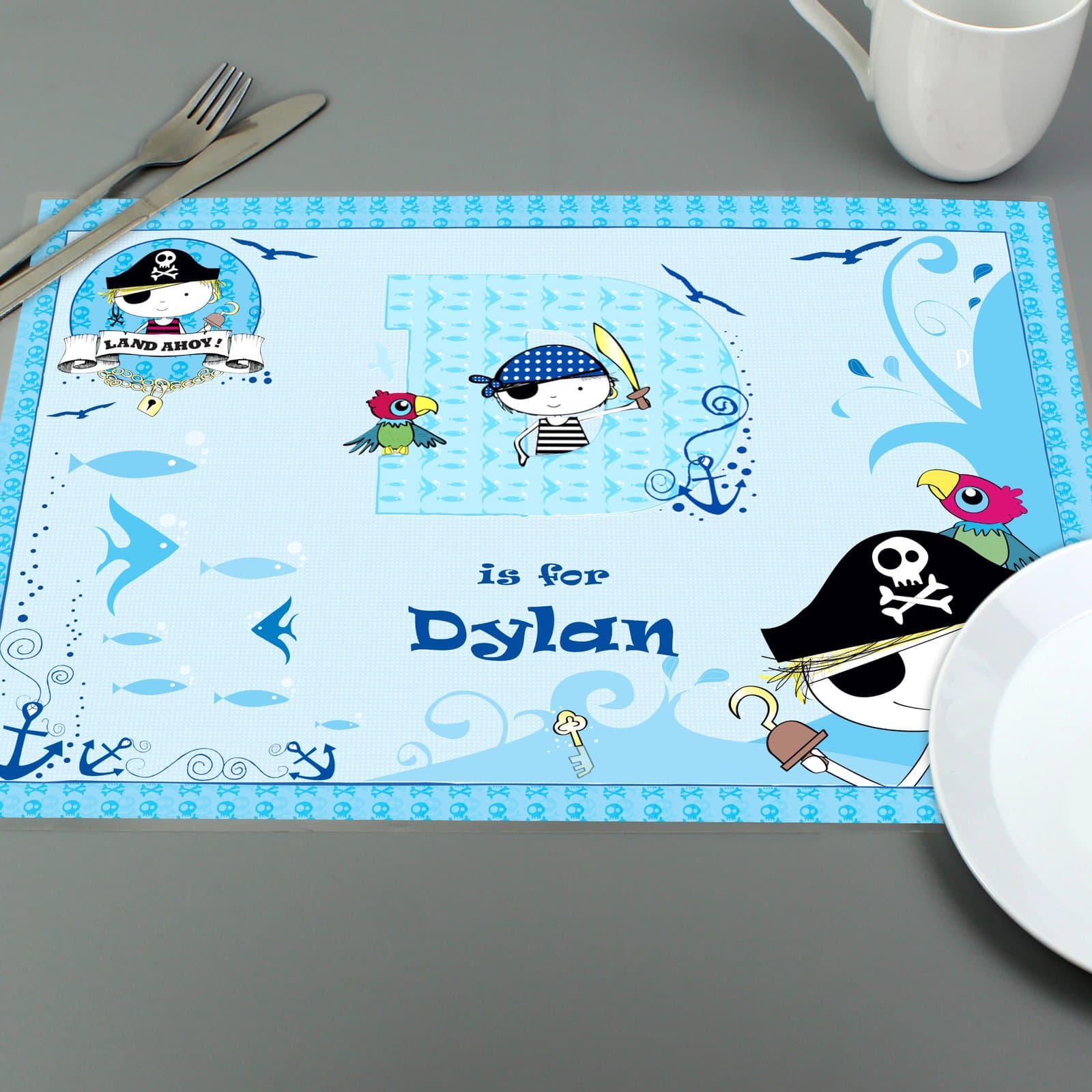Laminated pirate placemat printed with an initial and a child's name