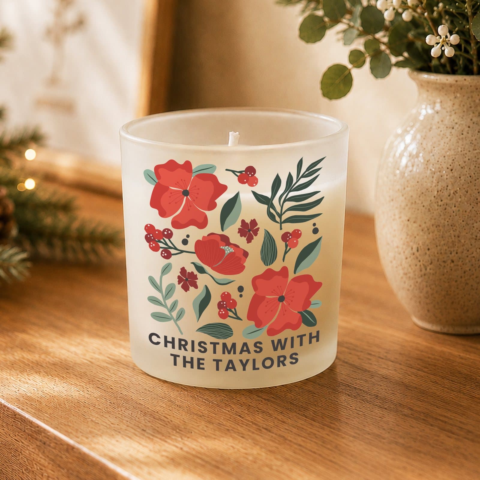 Personalised scented glass candle jar with a poinsettia design